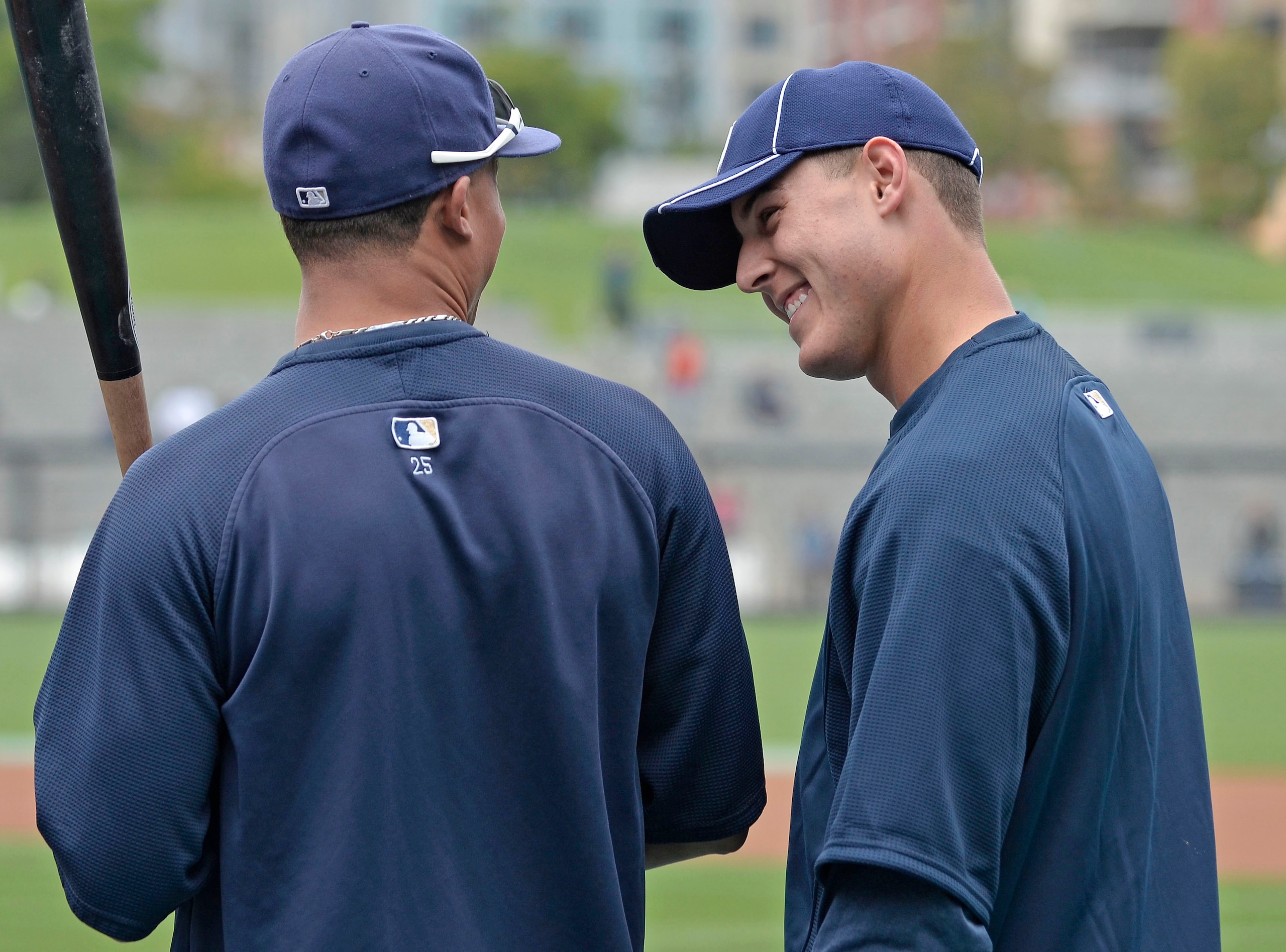 SAN DIEGO, CA - JUNE 9: Anthony Rizzo #27 of the San Diego Padres (R),  talks with teammate Will Venable, left, during batting practice before a baseball game against the Washington Nationals at Petco Park on June 9, 2011 in San Diego, California.  (Photo