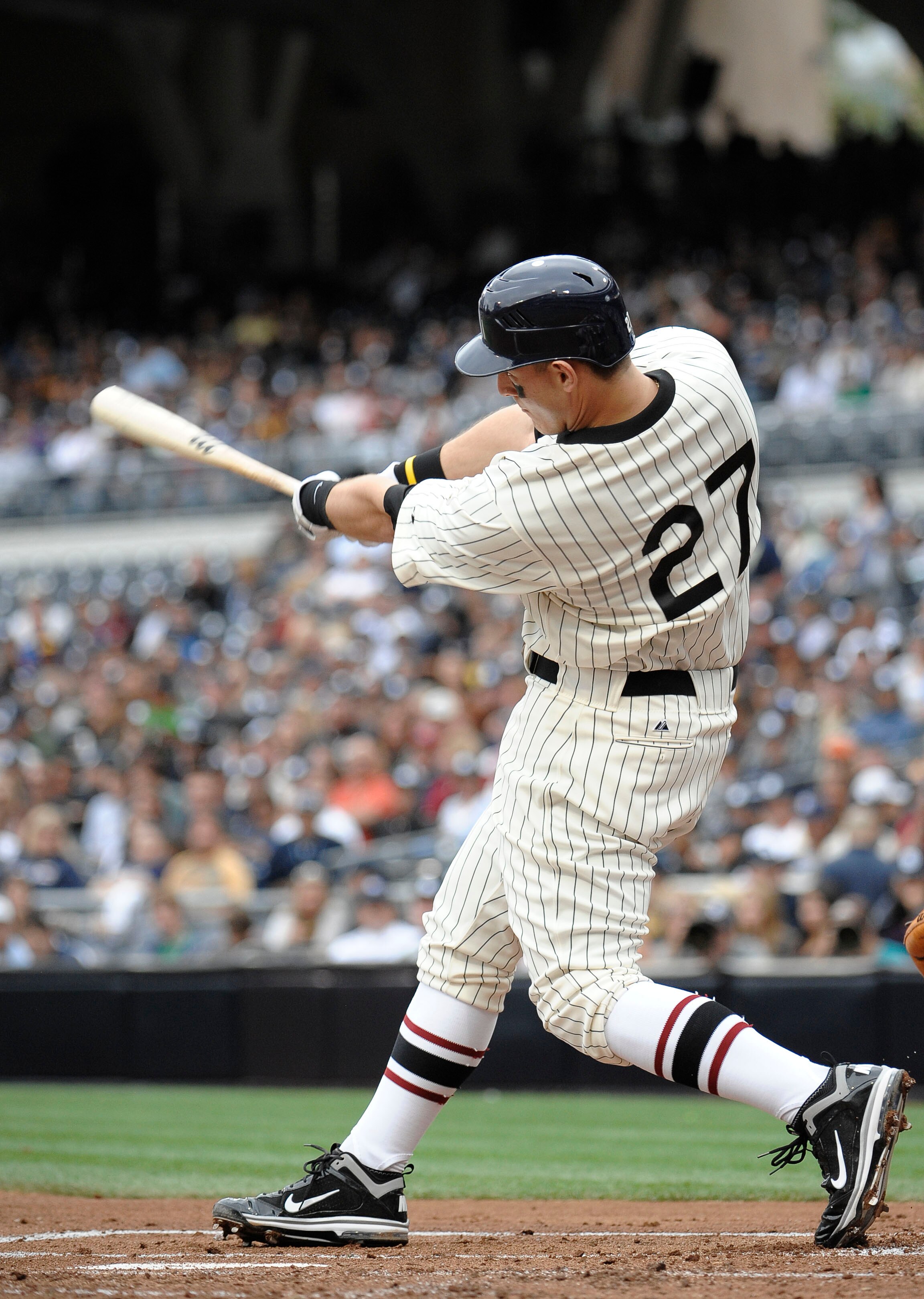SAN DIEGO, CA - JUNE 11: Anthony Rizzo #27 of the San Diego Padres hits a solo home run during the second inning of a baseball game against the Washington Nationals at Petco Park on June 11, 2011 in San Diego, California.   (Photo by Denis Poroy/Getty Ima