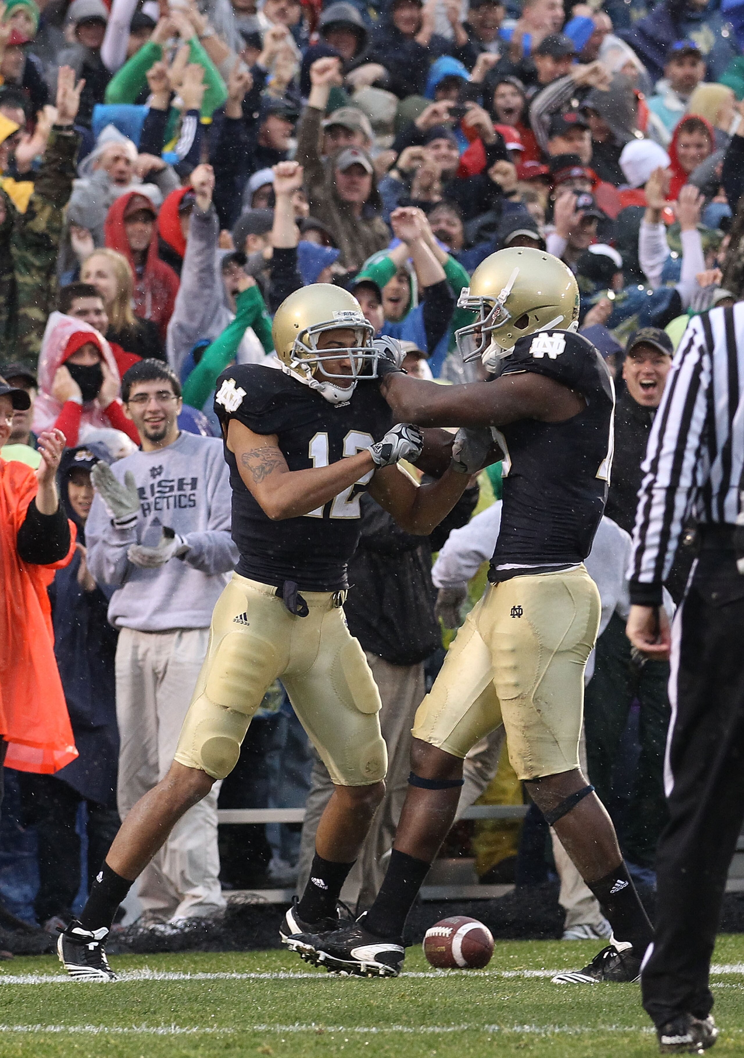 SOUTH BEND, IN - NOVEMBER 13: Duval Kamara #18 of the Notre Dame Fighting Irish (R) celebrates with teammate Robert Blanton #12 who blocked a punt and scored a touchdown against the Utah Utes at Notre Dame Stadium on November 13, 2010 in South Bend, India