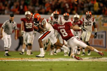 MIAMI, FL - JANUARY 03:  Jayron Hosley #20 of the Virginai Tech Hokies intercepts a pass in the second quarter against Ryan Whalen #8 of the Stanford Cardinal during the 2011 Discover Orange Bowl at Sun Life Stadium on January 3, 2011 in Miami, Florida.