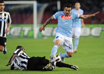 NAPLES, ITALY - APRIL 17:  Cristian Zapata of Udinese and Ezequiel Lavezzi of Napoli in action during the Serie A match between SSC Napoli and Udinese Calcio at Stadio San Paolo on April 17, 2011 in Naples, Italy.  (Photo by Giuseppe Bellini/Getty Images)