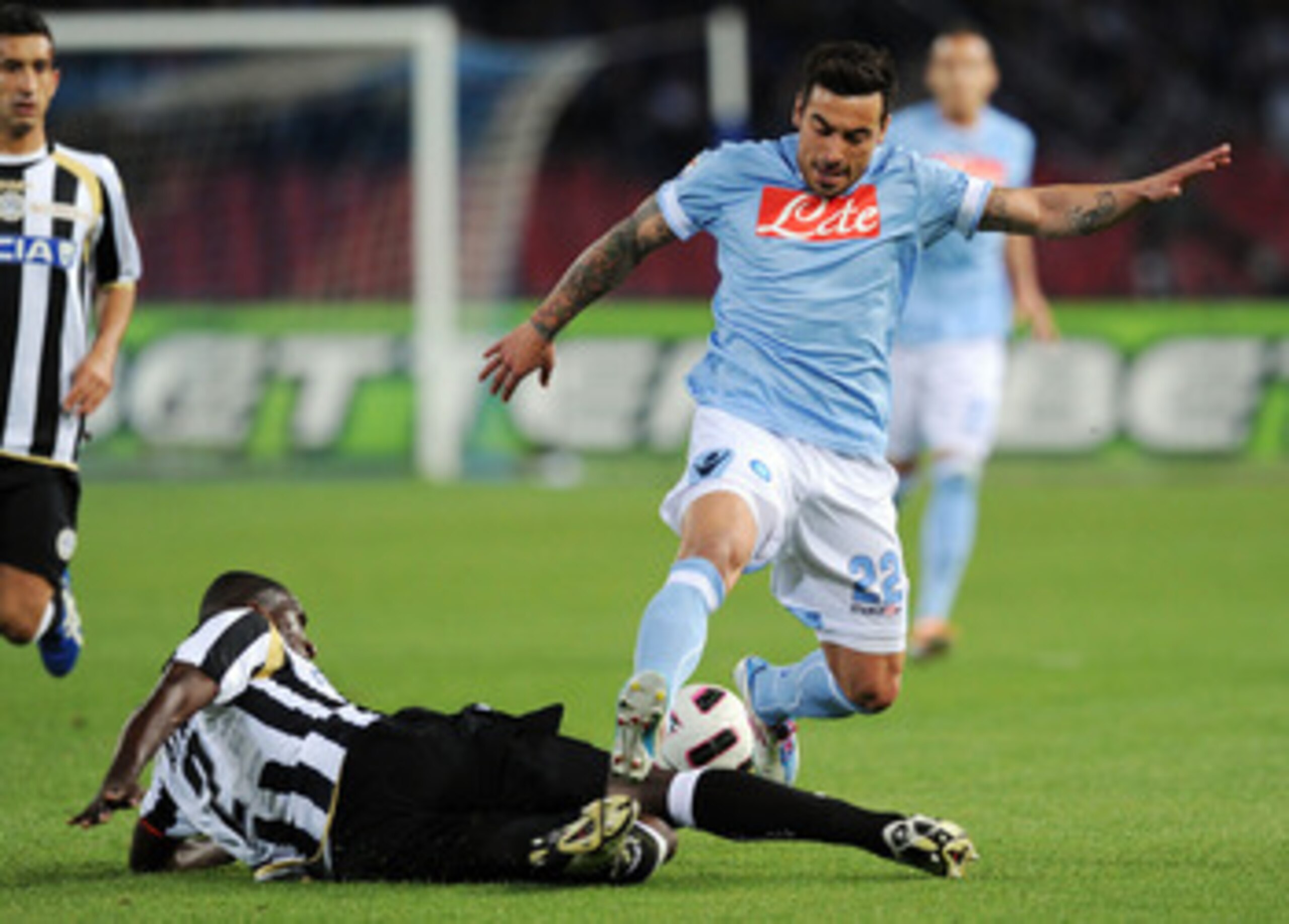 NAPLES, ITALY - APRIL 17:  Cristian Zapata of Udinese and Ezequiel Lavezzi of Napoli in action during the Serie A match between SSC Napoli and Udinese Calcio at Stadio San Paolo on April 17, 2011 in Naples, Italy.  (Photo by Giuseppe Bellini/Getty Images)