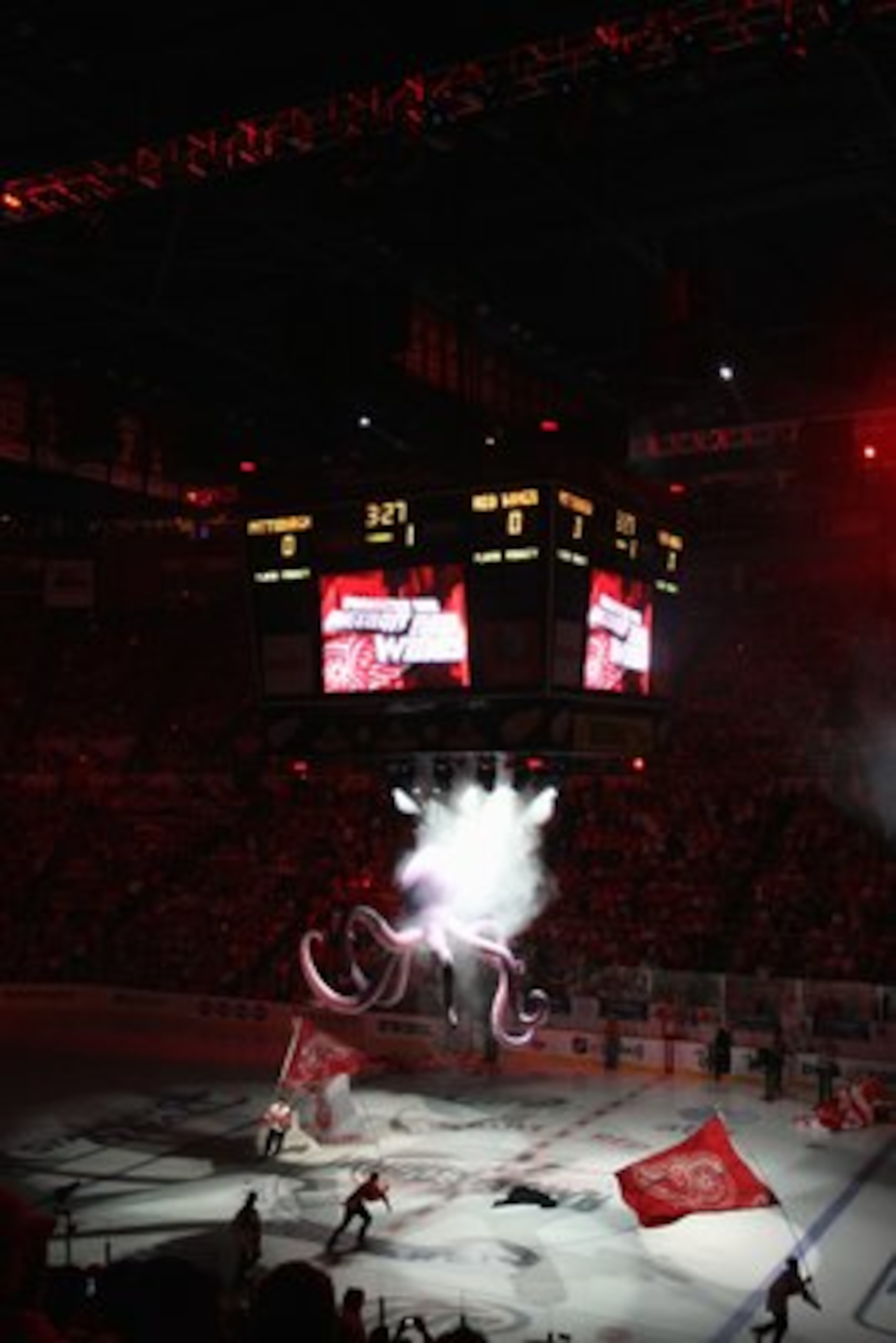DETROIT - JUNE 6:  Skaters carry flags around the ice prior to the start of Game Five of the 2009 NHL Stanley Cup Finals between the Pittsburgh Penguins and the Detroit Red Wings at Joe Louis Arena on June 6, 2009 in Detroit, Michigan. (Photo by: Bruce Be