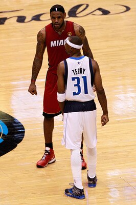 DALLAS, TX - JUNE 07: LeBron James #6 of the Miami Heat and Jason Terry #31 of the Dallas Mavericks stand on court in Game Four of the 2011 NBA Finals at American Airlines Center on June 7, 2011 in Dallas, Texas. The Mavericks won 86-83. NOTE TO USER: Use