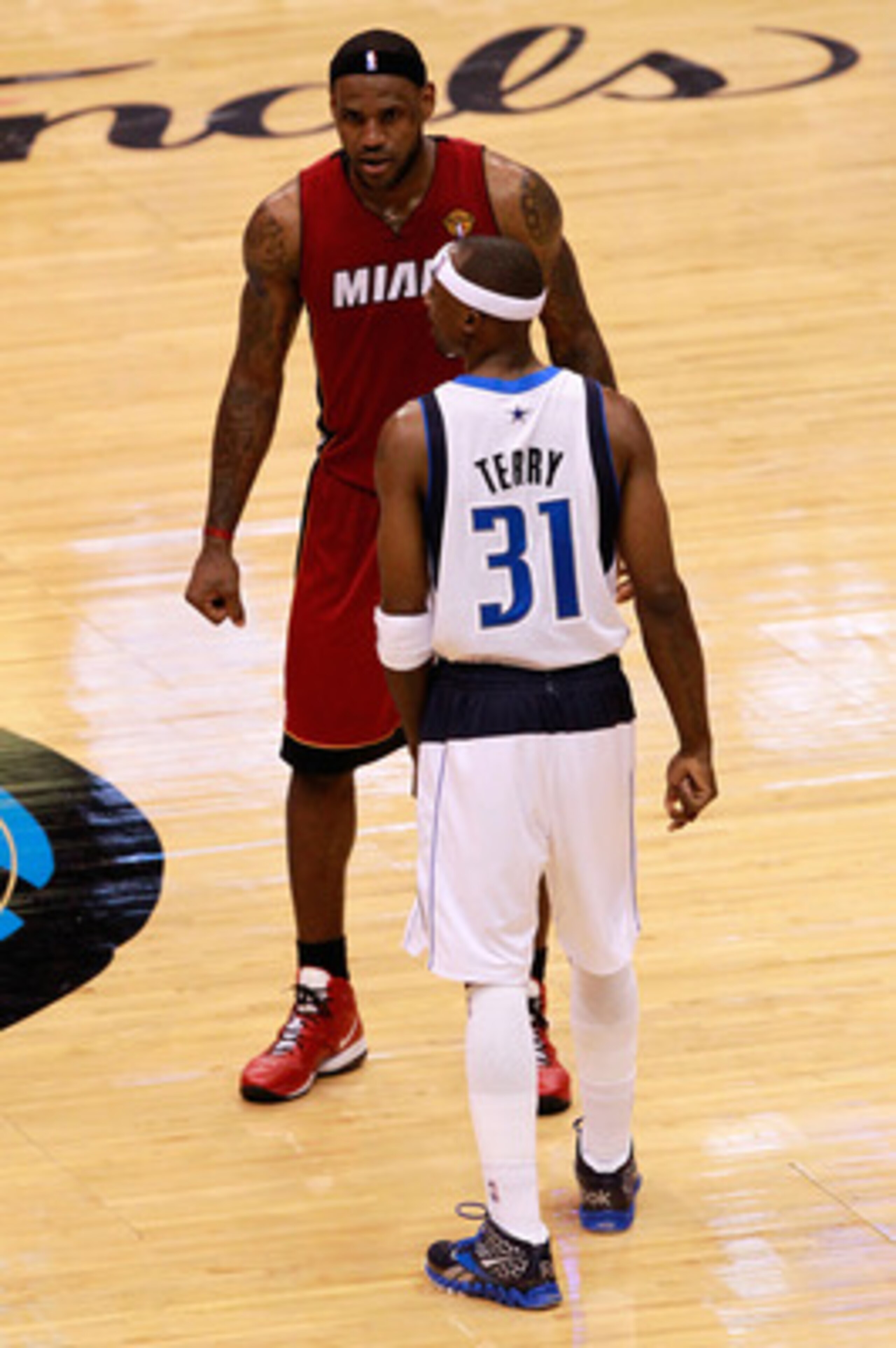 DALLAS, TX - JUNE 07: LeBron James #6 of the Miami Heat and Jason Terry #31 of the Dallas Mavericks stand on court in Game Four of the 2011 NBA Finals at American Airlines Center on June 7, 2011 in Dallas, Texas. The Mavericks won 86-83. NOTE TO USER: Use