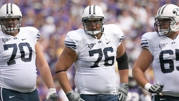 SEATTLE - SEPTEMBER 6:  (L-R) Matt Reynolds #70, Ray Feinga #76 and Dallas Reynolds #65 of the BYU Cougars look on during a break in game action against the Washington Huskies on September 6, 2008 at Husky Stadium in Seattle, Washington. The Cougars defea