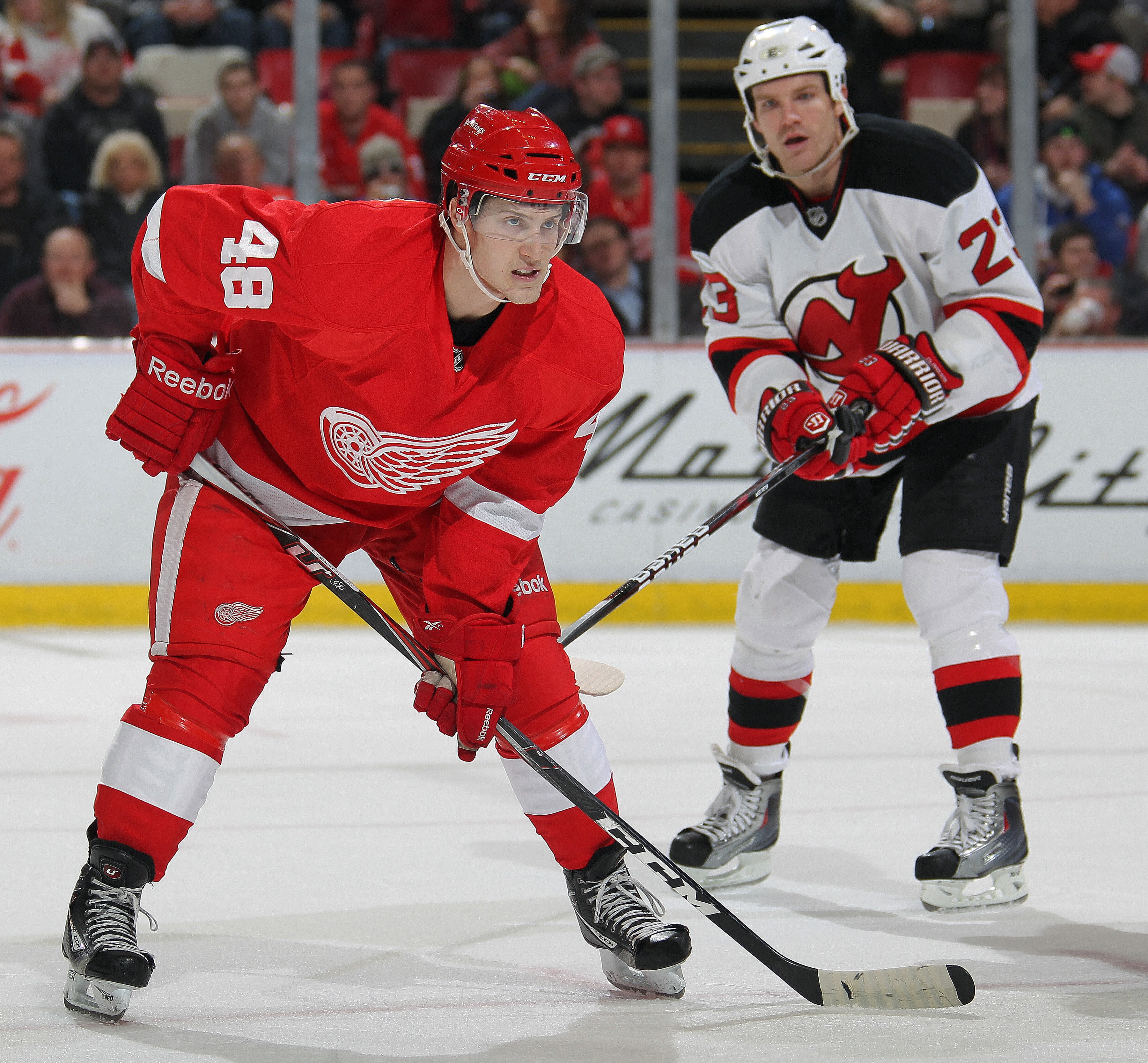 DETROIT, MI - JANUARY 26:  David Clarkson #23 of the New Jersey Devils reacts to the way rookie Cory Emmerton #48 of the Detroit Red Wings is lining up for a faceoff in a game on January 26, 2011 at the Joe Louis Arena in Detroit, Michigan. The Wings defe