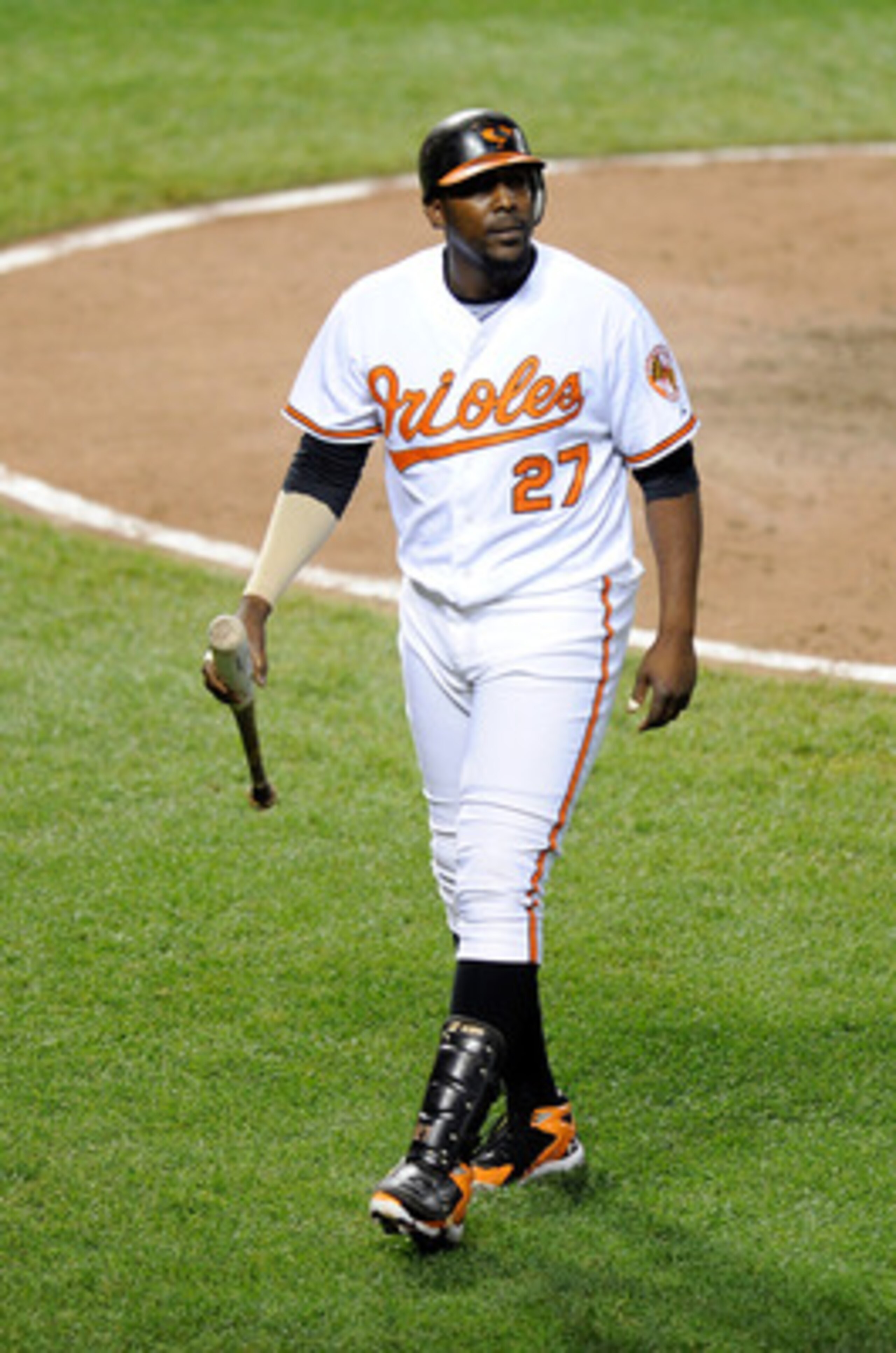 BALTIMORE, MD - JUNE 11:  Vladimir Guerrero #27 of the Baltimore Orioles walks to the dugout after striking out against the Tampa Bay Rays at Oriole Park at Camden Yards on June 11, 2011 in Baltimore, Maryland.  (Photo by Greg Fiume/Getty Images)