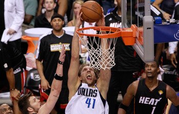 DALLAS, TX - JUNE 09:  Dirk Nowitzki #41 of the Dallas Mavericks dunks against Mike Miller #13 and LeBron James #6 of the Miami Heat late in the fourth quarter in Game Five of the 2011 NBA Finals at American Airlines Center on June 9, 2011 in Dallas, Texa