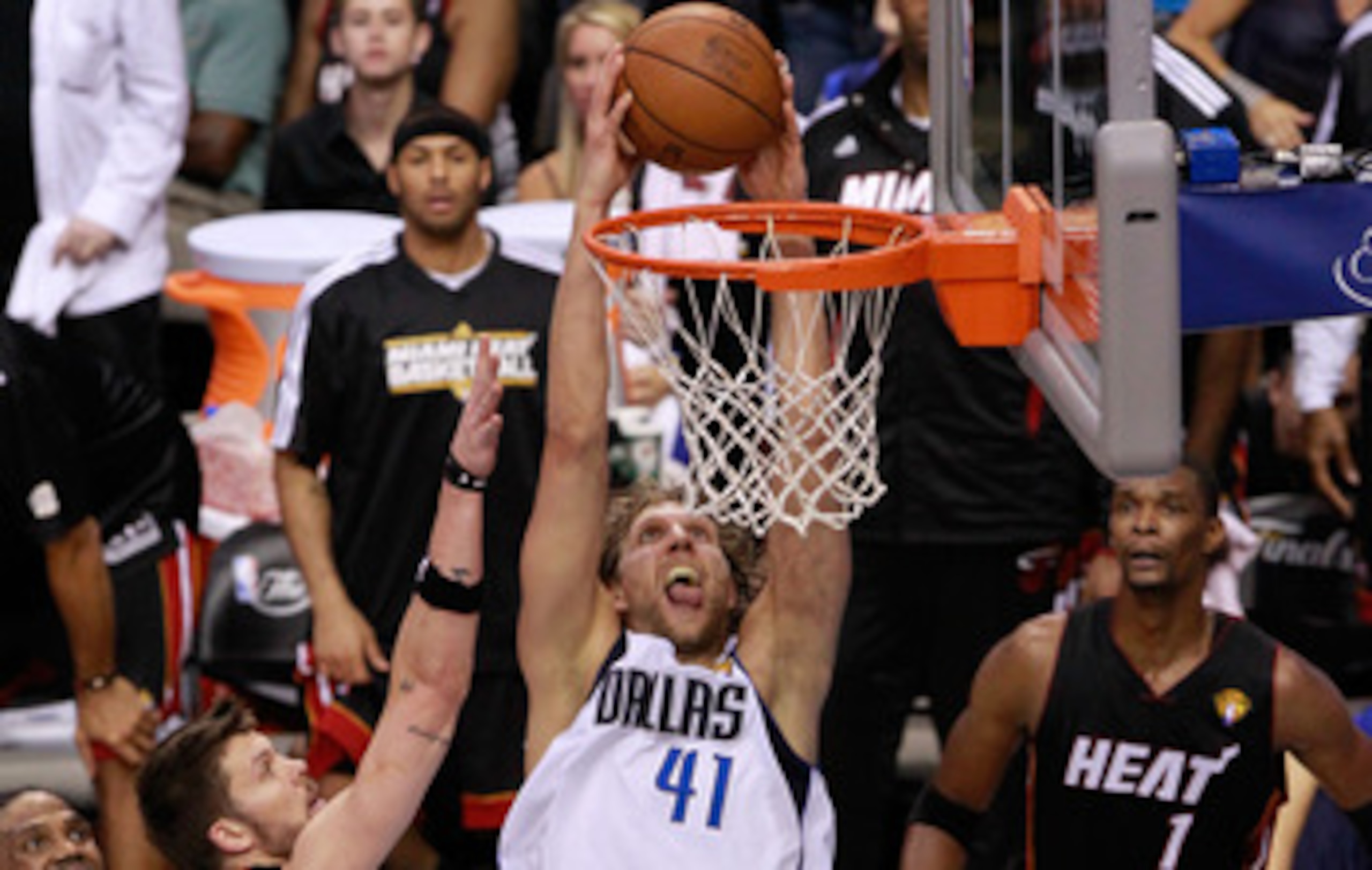 DALLAS, TX - JUNE 09:  Dirk Nowitzki #41 of the Dallas Mavericks dunks against Mike Miller #13 and LeBron James #6 of the Miami Heat late in the fourth quarter in Game Five of the 2011 NBA Finals at American Airlines Center on June 9, 2011 in Dallas, Texa