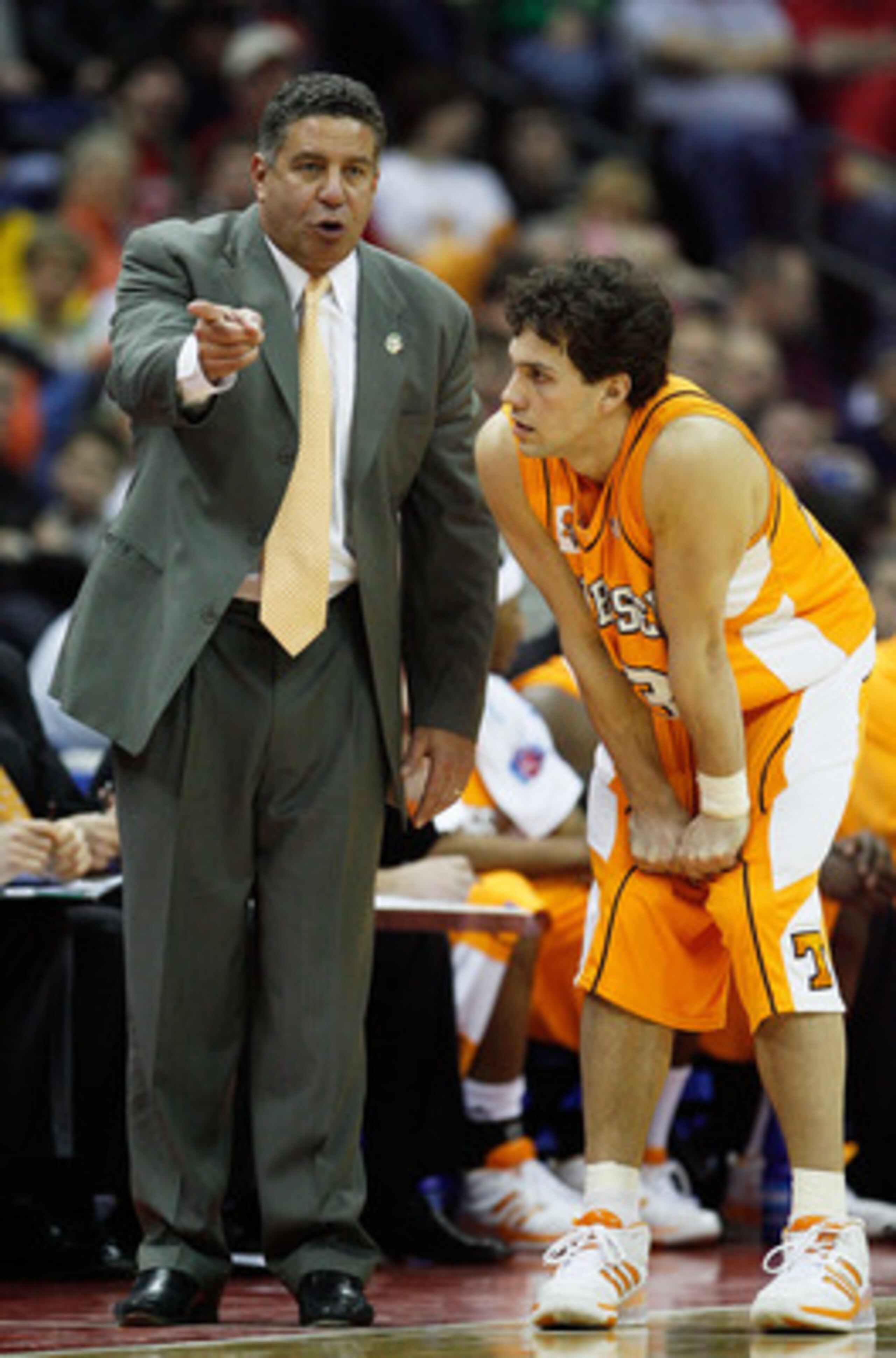 COLUMBUS, OH - MARCH 18:  Head coach Bruce Pearl of the Tennessee Volunteers talks with Dane Bradshaw #23 during their game against the Virginia Cavaliers during the second round of the NCAA Men's Basketball Tournament at Nationwide Arena on March 18, 200