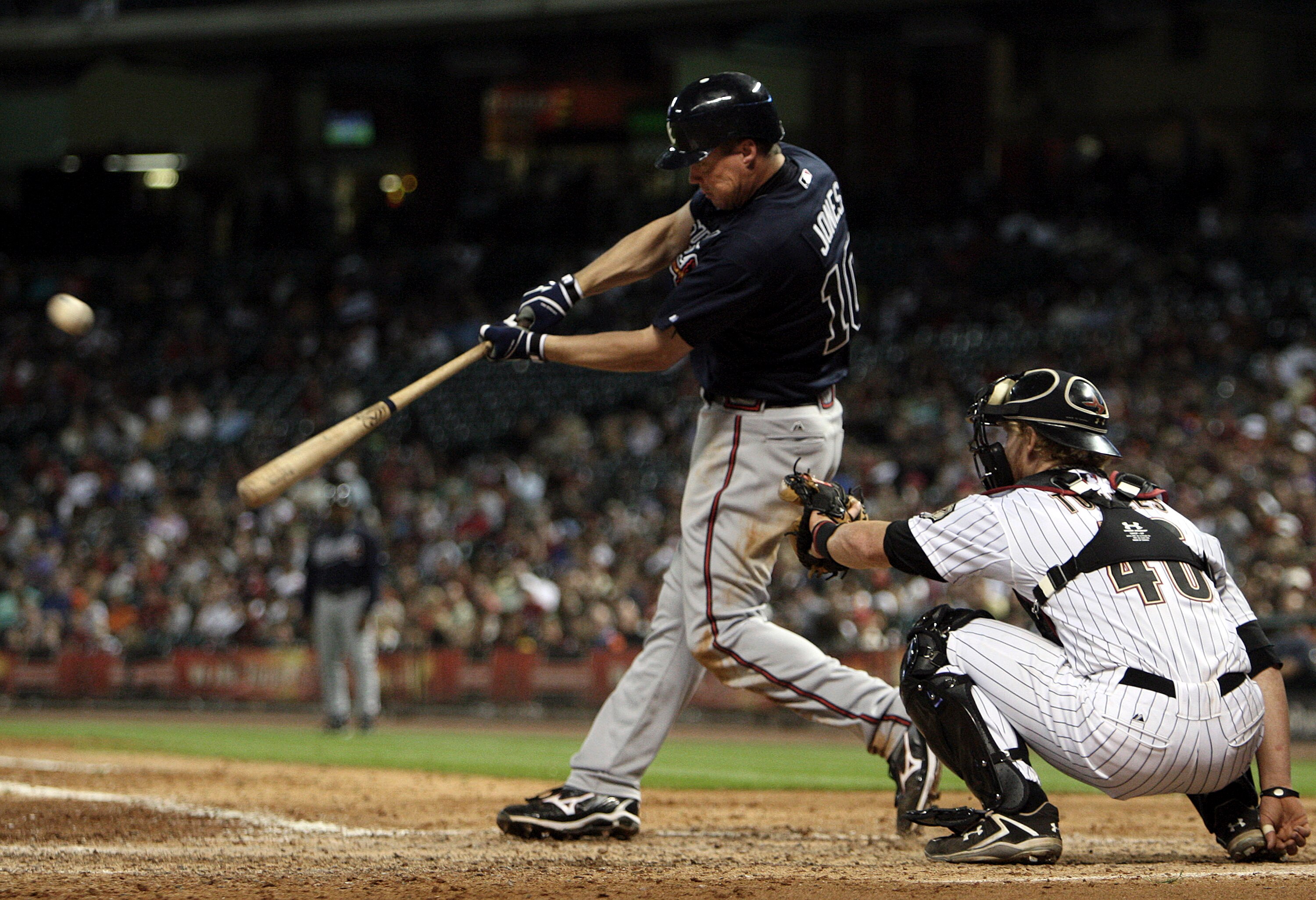 HOUSTON - JUNE 10:  Chipper Jones #10 of the Atlanta Braves hits a home run in the eighth inning against the Houston Astros at Minute Maid Park on June 10, 2011 in Houston, Texas.  (Photo by Bob Levey/Getty Images)