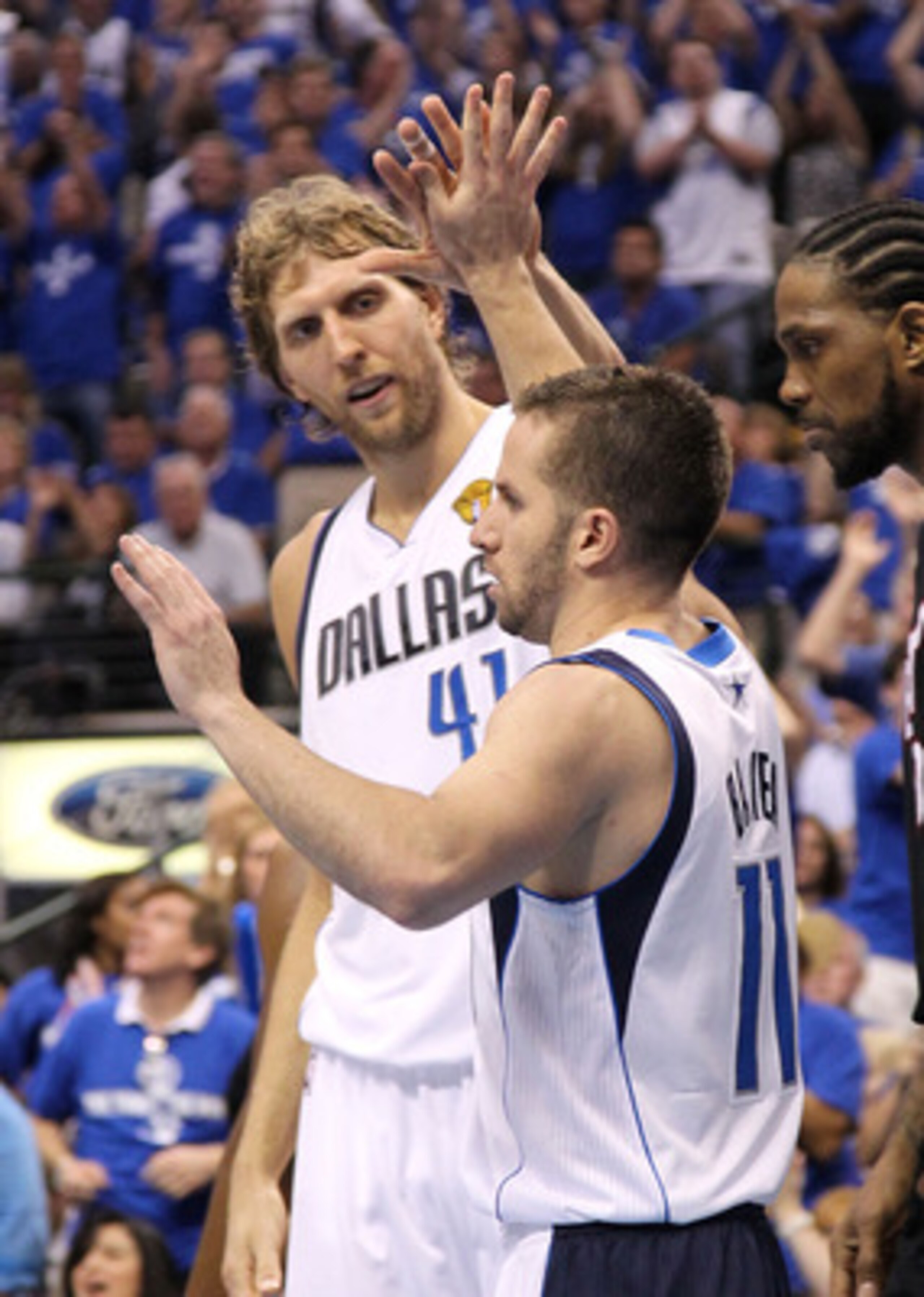 DALLAS, TX - JUNE 09:  Jose Juan Barea #11 and Dirk Nowitzki #41 of the Dallas Mavericks celebrate a play in the second half against Udonis Haslem #40 of the Miami Heat in Game Five of the 2011 NBA Finals at American Airlines Center on June 9, 2011 in Dal