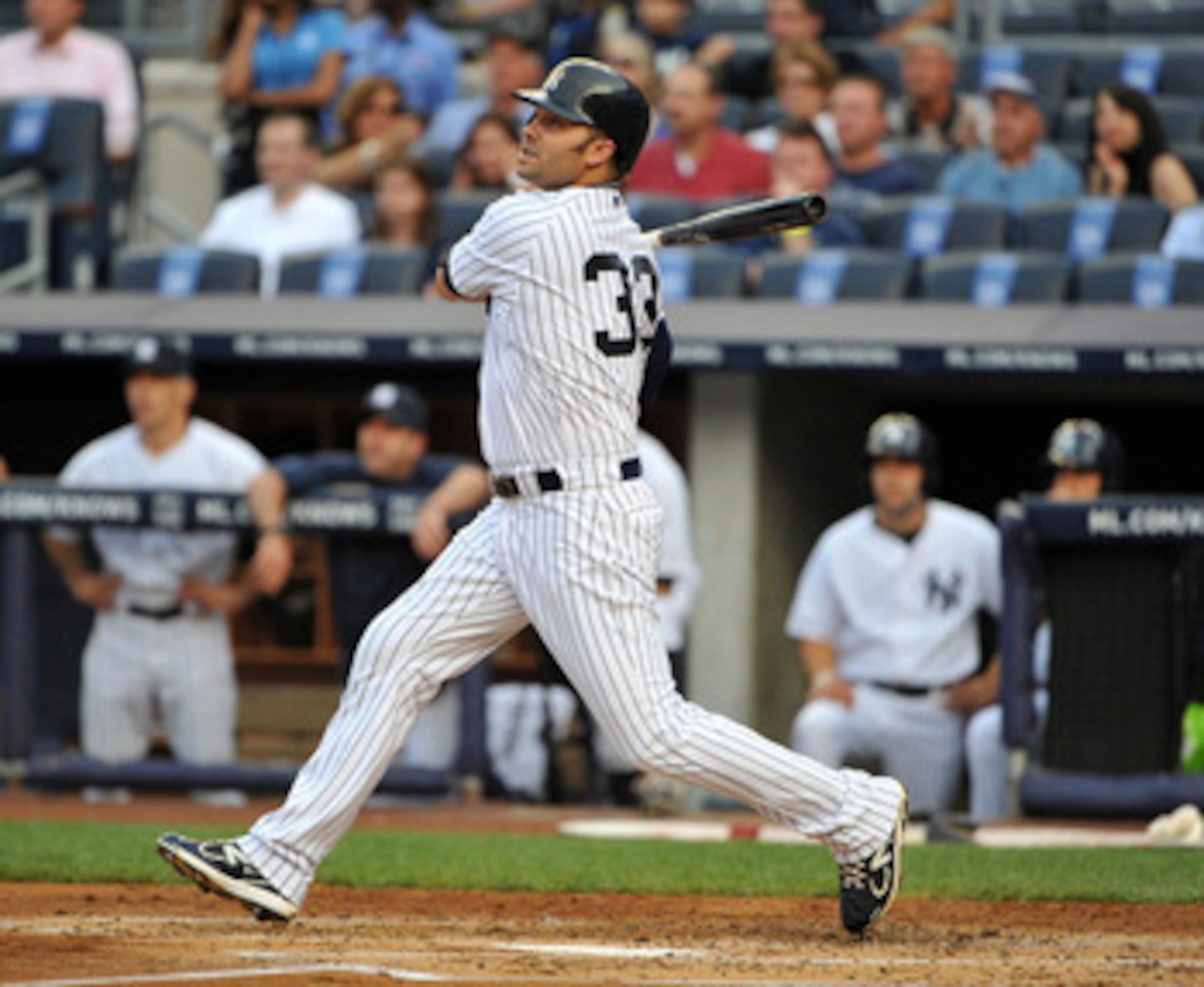 NEW YORK, NY - JUNE 10: Nick Swisher #33 of the New York Yankees watches his RBI sacrifice fly in the bottom of the first inning against the Cleveland Indians on June 10, 2011 at Yankee Stadium in the Bronx borough of New York City. (Photo by Christopher