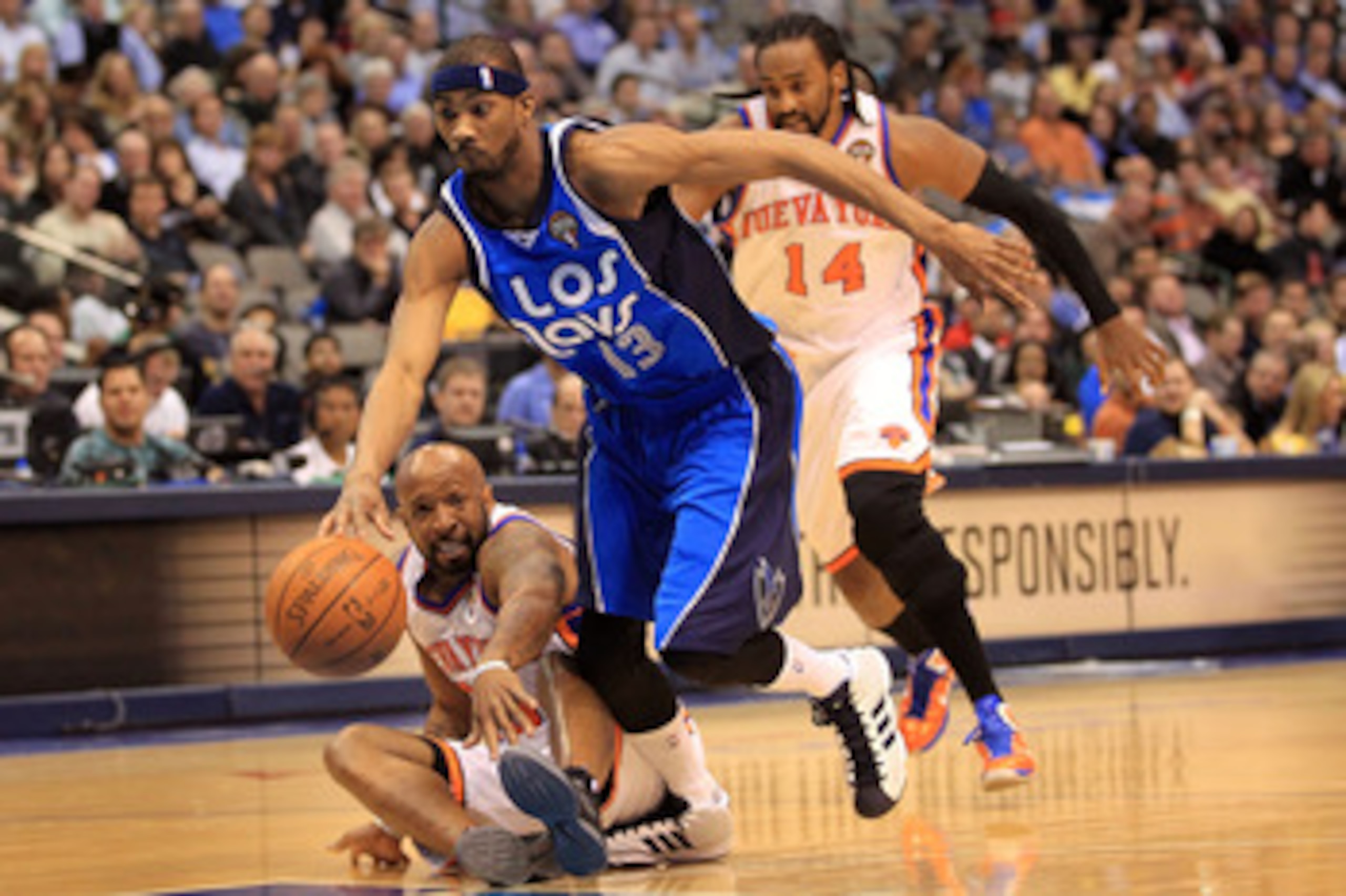 DALLAS, TX - MARCH 10:  Forward Corey Brewer #13 of the Dallas Mavericks steals the ball from Anthony Carter #25 of the New York Knicks at American Airlines Center on March 10, 2011 in Dallas, Texas.  NOTE TO USER: User expressly acknowledges and agrees t
