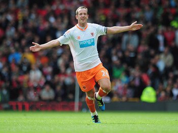 MANCHESTER, ENGLAND - MAY 22:  Charlie Adam of Blackpool celebrates as scores their first goal from a free kick during the Barclays Premier League match between Manchester United and Blackpool at Old Trafford on May 22, 2011 in Manchester, England.  (Phot