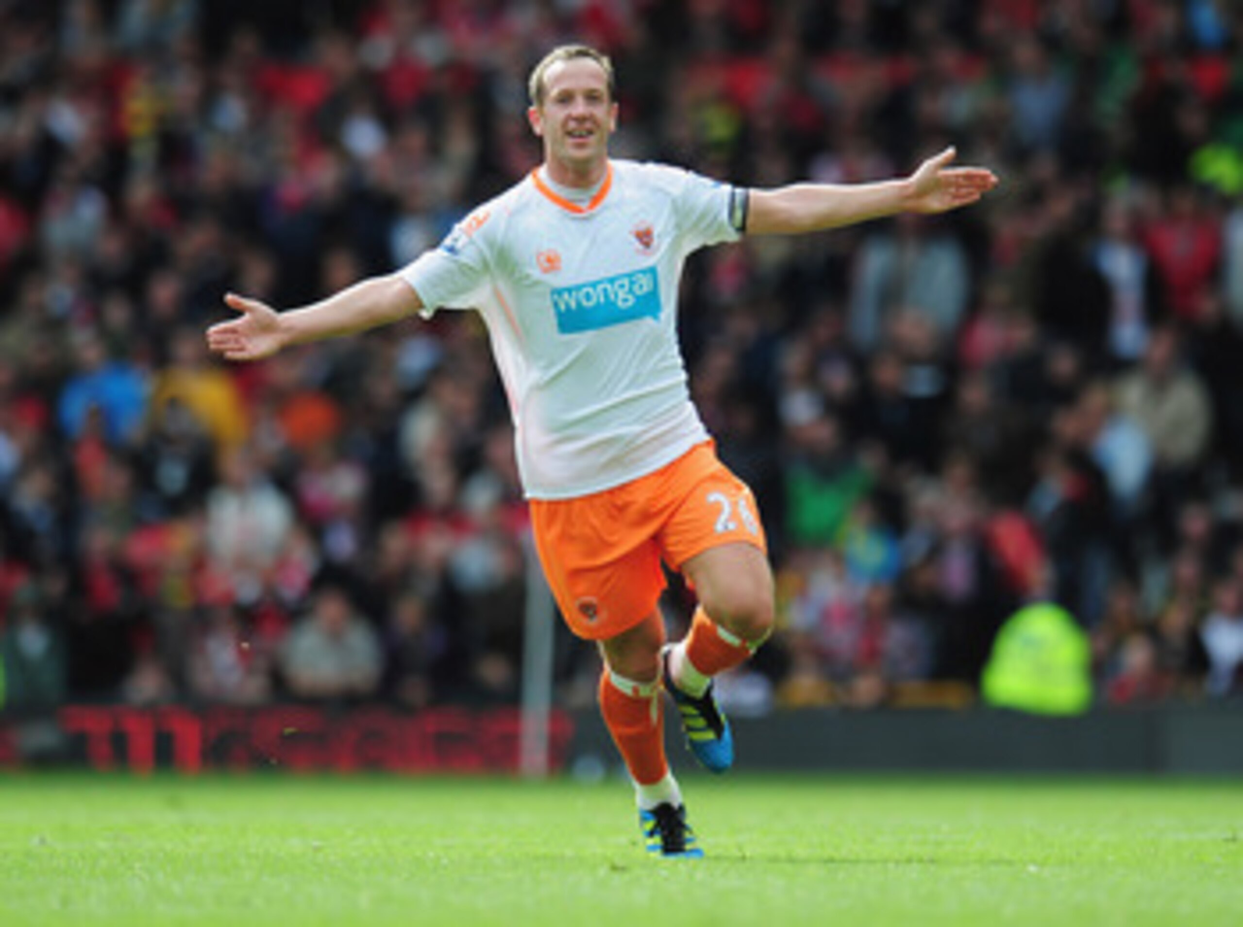 MANCHESTER, ENGLAND - MAY 22:  Charlie Adam of Blackpool celebrates as scores their first goal from a free kick during the Barclays Premier League match between Manchester United and Blackpool at Old Trafford on May 22, 2011 in Manchester, England.  (Phot