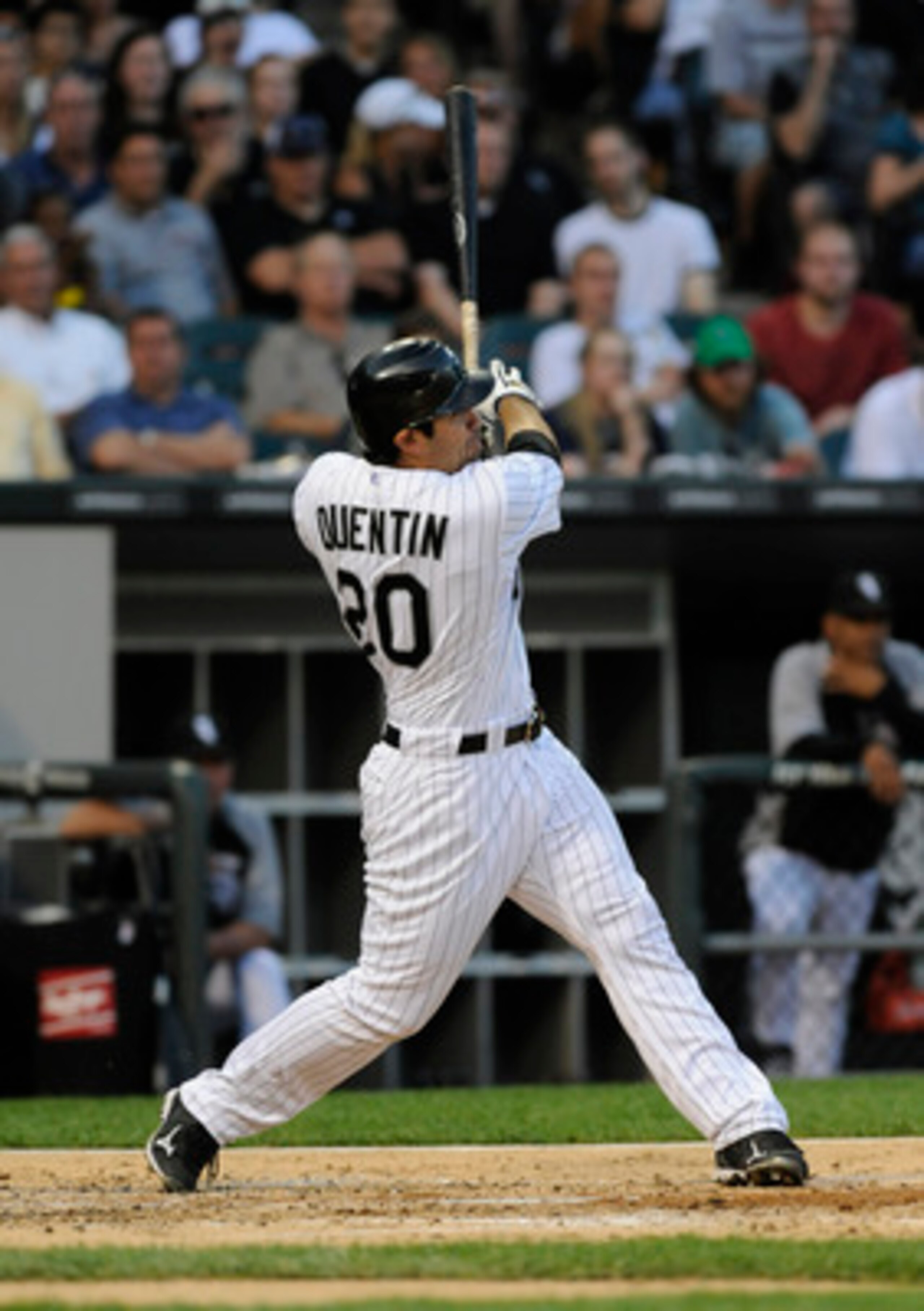 CHICAGO, IL - JUNE 07: Carlos Quentin # 20 of the Chicago White Sox hits a two-run homer against the Seattle Mariners in the third inning on June 7, 2011 at U.S. Cellular Field in Chicago, Illinois.  (Photo by David Banks/Getty Images)