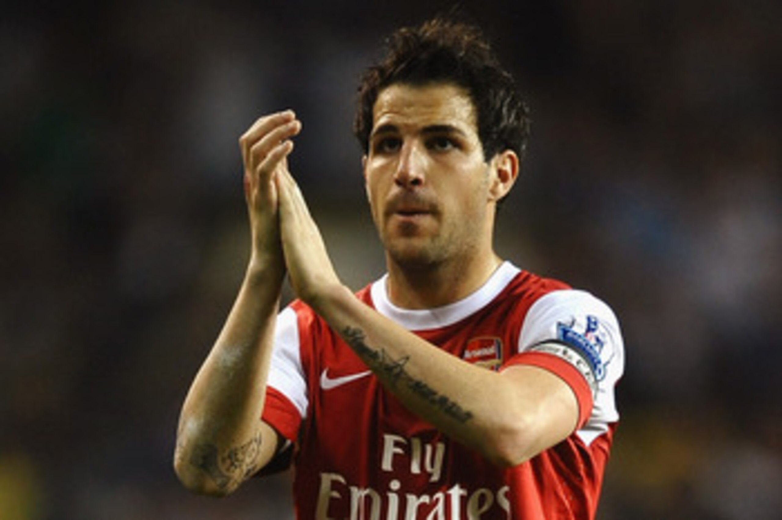 LONDON, ENGLAND - APRIL 20:  Cesc Fabregas of Arsenal applauds the fans during the Barclays Premier League match between Tottenham Hotspur and Arsenal at White Hart Lane on April 20, 2011 in London, England.  (Photo by Laurence Griffiths/Getty Images)