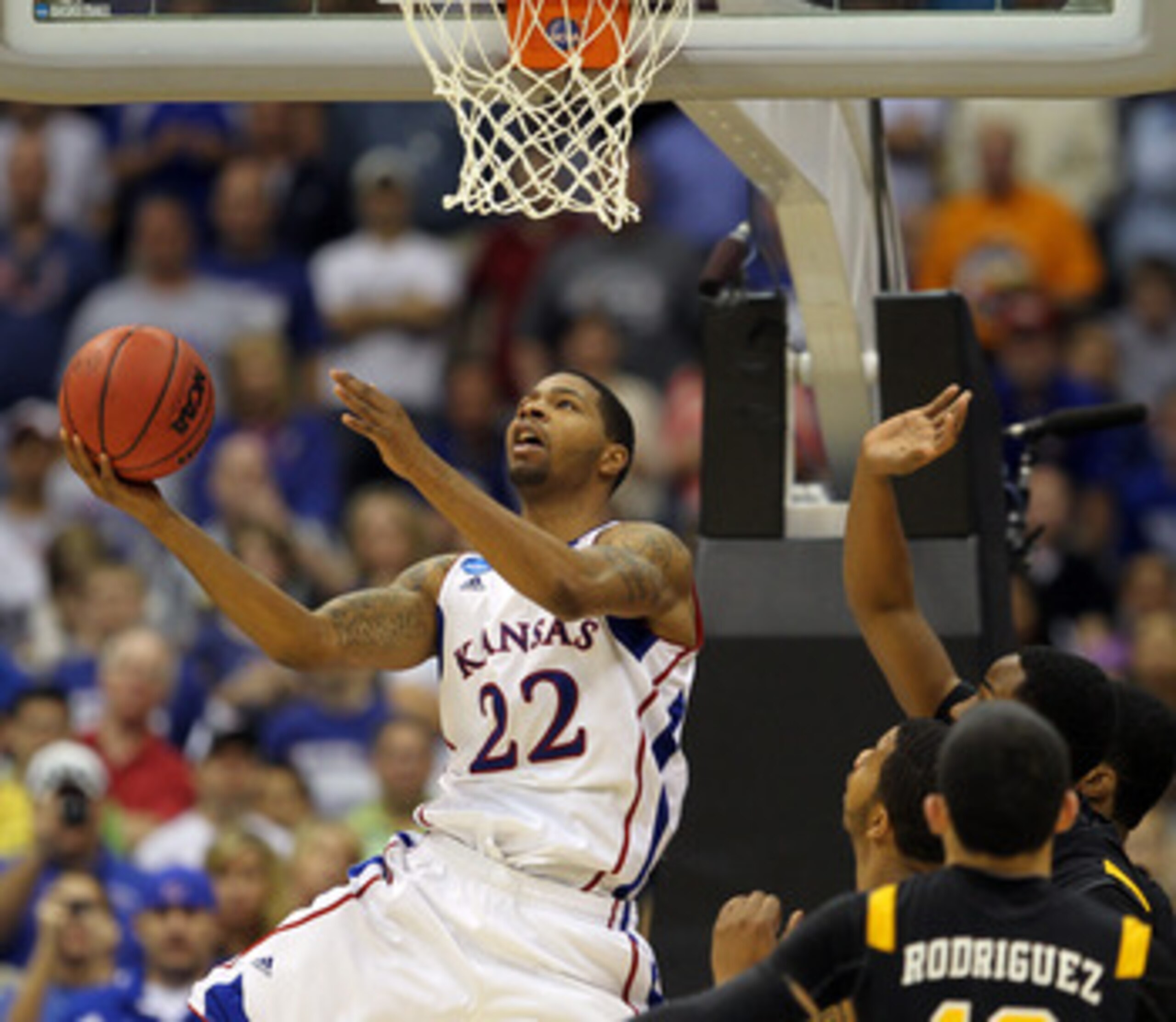 SAN ANTONIO, TX - MARCH 27:  Marcus Morris #22 of the Kansas Jayhawks goes to the basket against the Virginia Commonwealth Rams during the southwest regional final of the 2011 NCAA men's basketball tournament at the Alamodome on March 27, 2011 in San Anto