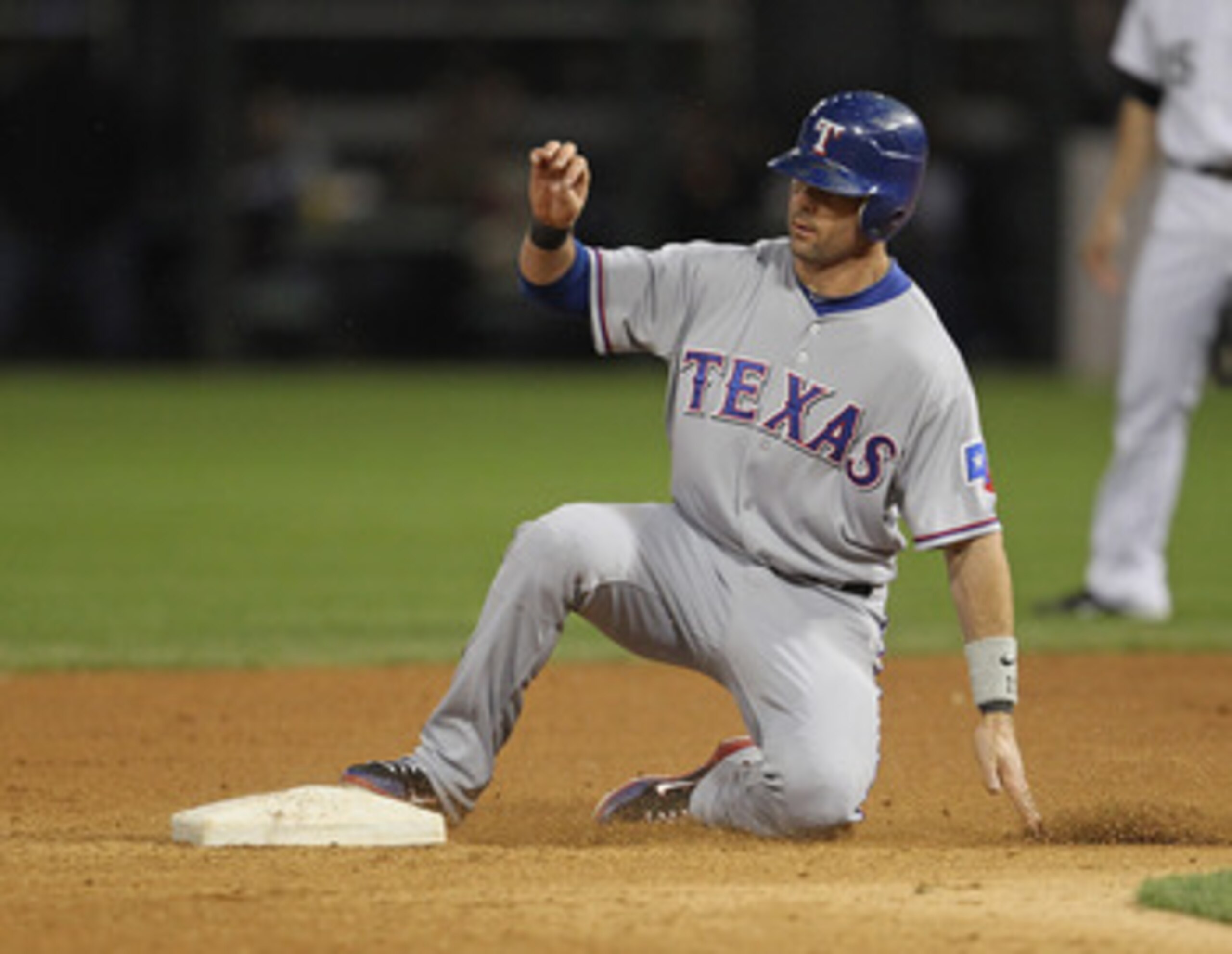 CHICAGO, IL - MAY 17: Michael Young #10 of the Texas Rangers slides into 2nd base against the Chicago White Sox at U.S. Cellular Field on May 17, 2011 in Chicago, Illinois. The White Sox defeated the Rangers 4-3. (Photo by Jonathan Daniel/Getty Images)