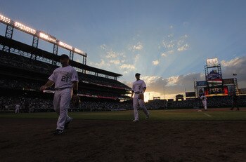 DENVER, CO - JUNE 10: Ty Wigginton #21 and Troy Tulowitzki #2 of the Colorado Rockies head for the dugout between innings against the Los Angeles Dodgers at Coors Field on June 10, 2011 in Denver, Colorado. (Photo by Doug Pensinger/Getty Images) DENVER, CO - JUNE 10: Ty Wigginton #21 and Troy Tulowitzki #2 of the Colorado Rockies head for the dugout between innings against the Los Angeles Dodgers at Coors Field on June 10, 2011 in Denver, Colorado. (Photo by Doug Pensinger/Getty Images)