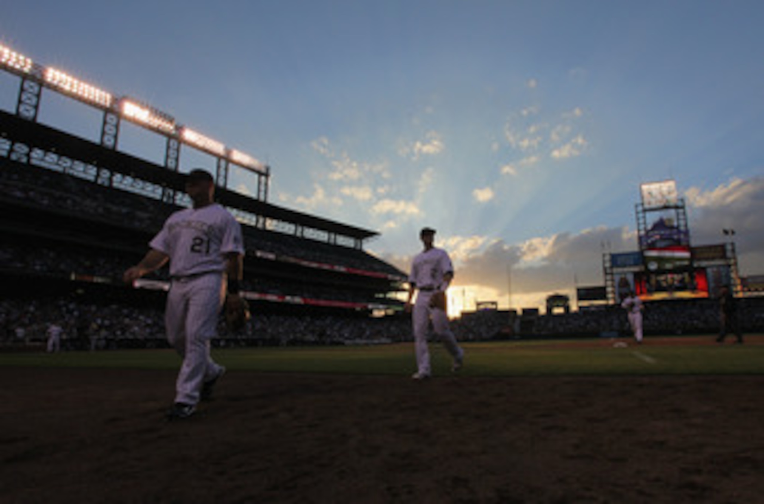 DENVER, CO - JUNE 10: Ty Wigginton #21 and Troy Tulowitzki #2 of the Colorado Rockies head for the dugout between innings against the Los Angeles Dodgers at Coors Field on June 10, 2011 in Denver, Colorado. (Photo by Doug Pensinger/Getty Images) DENVER, CO - JUNE 10: Ty Wigginton #21 and Troy Tulowitzki #2 of the Colorado Rockies head for the dugout between innings against the Los Angeles Dodgers at Coors Field on June 10, 2011 in Denver, Colorado. (Photo by Doug Pensinger/Getty Images)