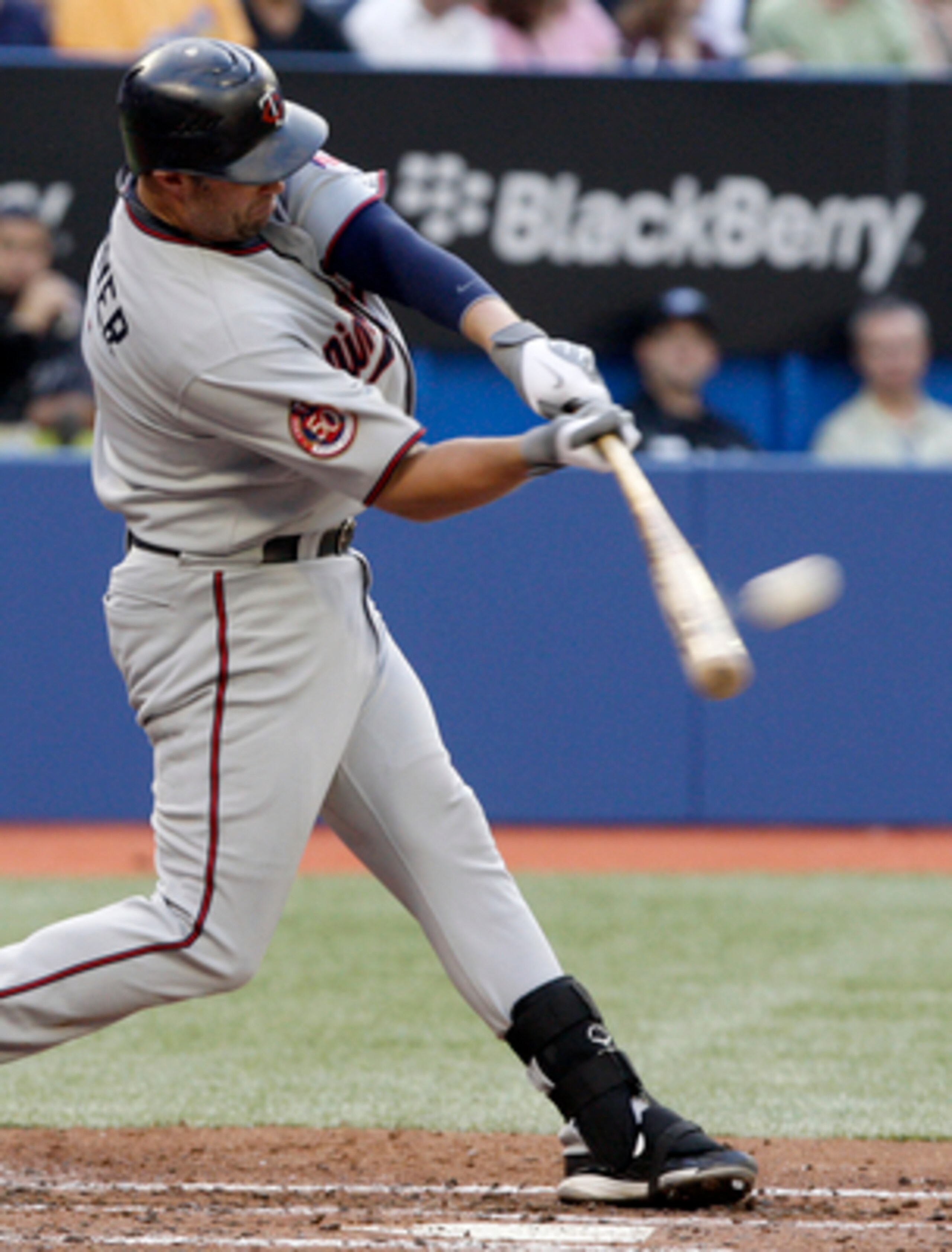 TORONTO - JULY 8: Michael Cuddyer #5 of the Minnesota Twins hits a home run during a MLB game against the Toronto Blue Jays at The Rogers Centre July 8, 2010 in Toronto, Ontario, Canada. (Photo by Abelimages/Getty Images)
