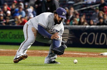 ATLANTA, GA - MAY 04:  Prince Fielder #28 of the Milwaukee Brewers fields a bunt by Tim Hudson #15 of the Atlanta Braves in the second inning at Turner Field on May 4, 2011 in Atlanta, Georgia.  (Photo by Kevin C. Cox/Getty Images)