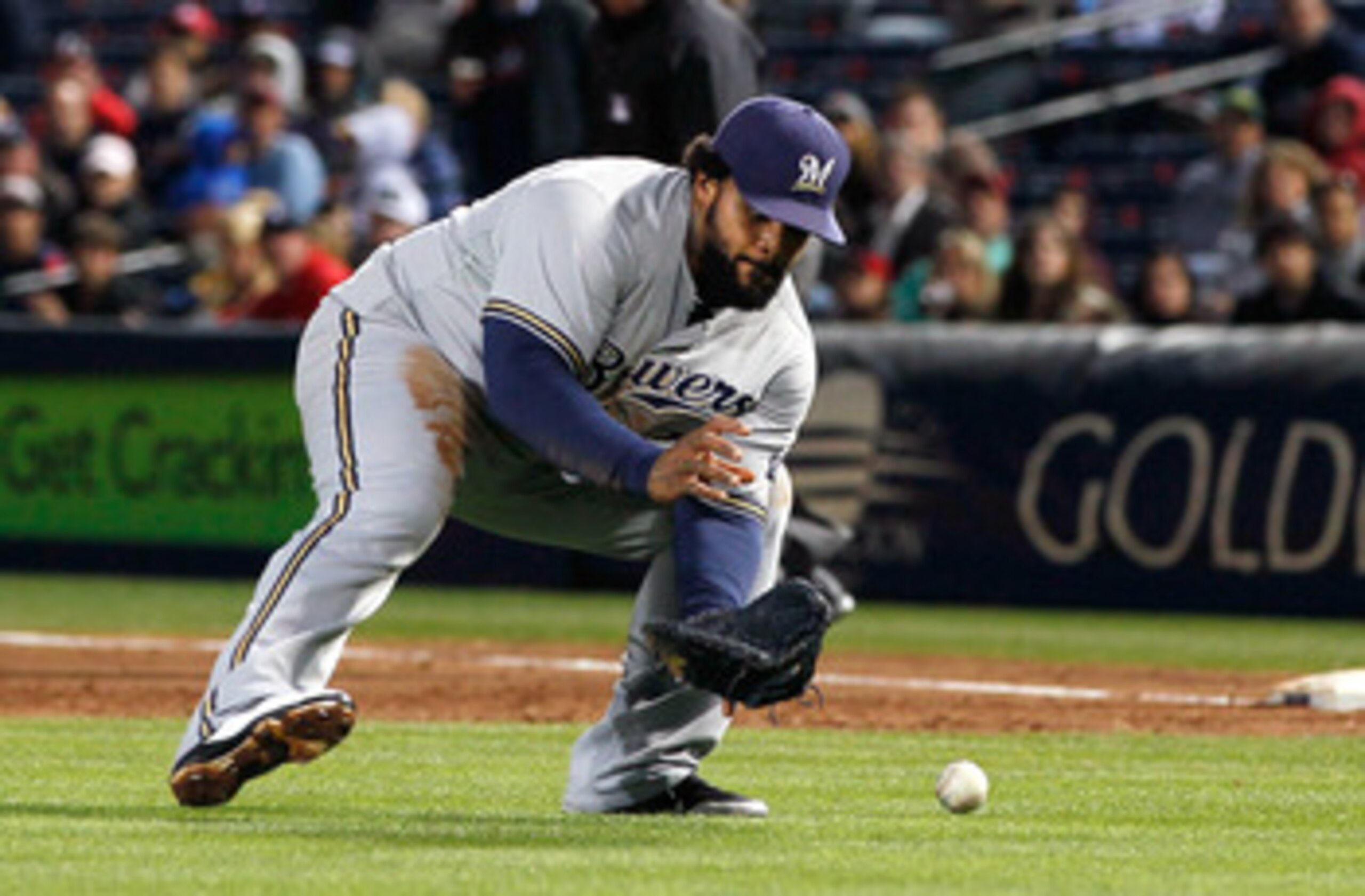 ATLANTA, GA - MAY 04:  Prince Fielder #28 of the Milwaukee Brewers fields a bunt by Tim Hudson #15 of the Atlanta Braves in the second inning at Turner Field on May 4, 2011 in Atlanta, Georgia.  (Photo by Kevin C. Cox/Getty Images)