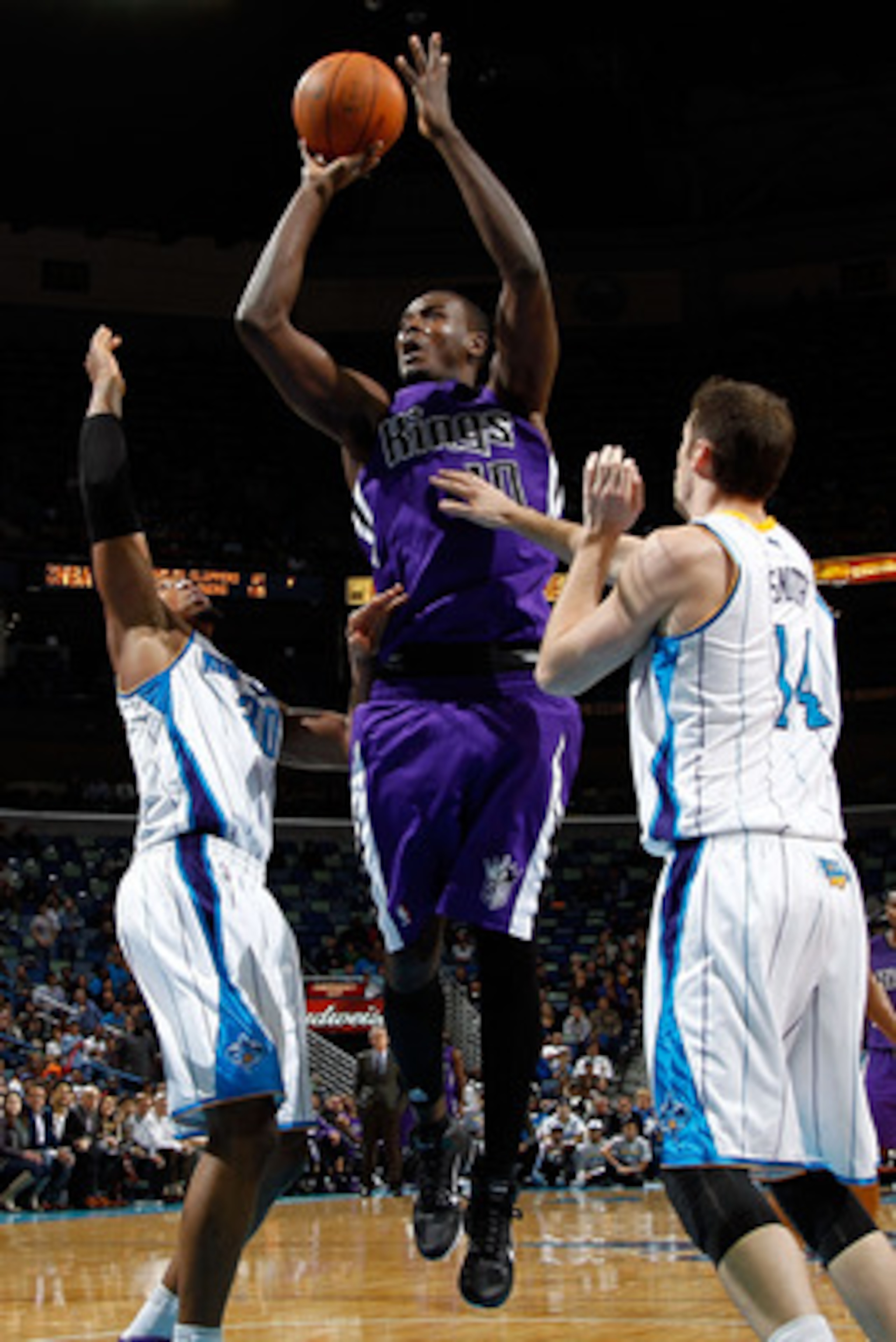 NEW ORLEANS, LA - DECEMBER 15:  Samuel Dalembert #10 of the Sacramento Kings shoots the ball over David West #30 and Jason Smith #14 of the New Orleans Hornets  at the New Orleans Arena on December 15, 2010 in New Orleans, Louisiana.  The Hornets defeated