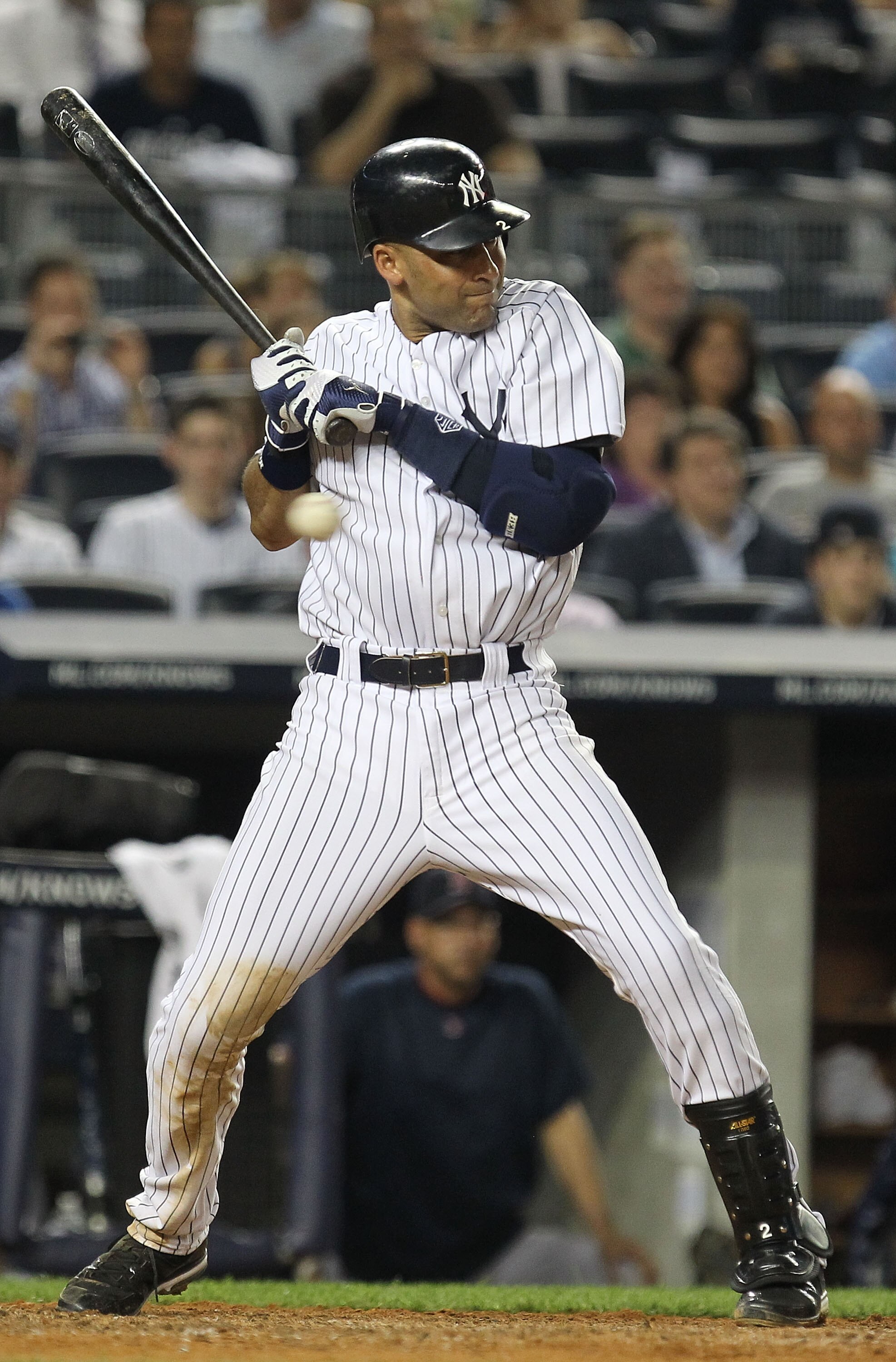 NEW YORK, NY - JUNE 08:  Derek Jeter #2 of the New York Yankees avoids getting hit by a pitch during the game against the Boston Red Sox on June 8, 2011 at Yankee Stadium in the Bronx borough of New York City.  (Photo by Al Bello/Getty Images)