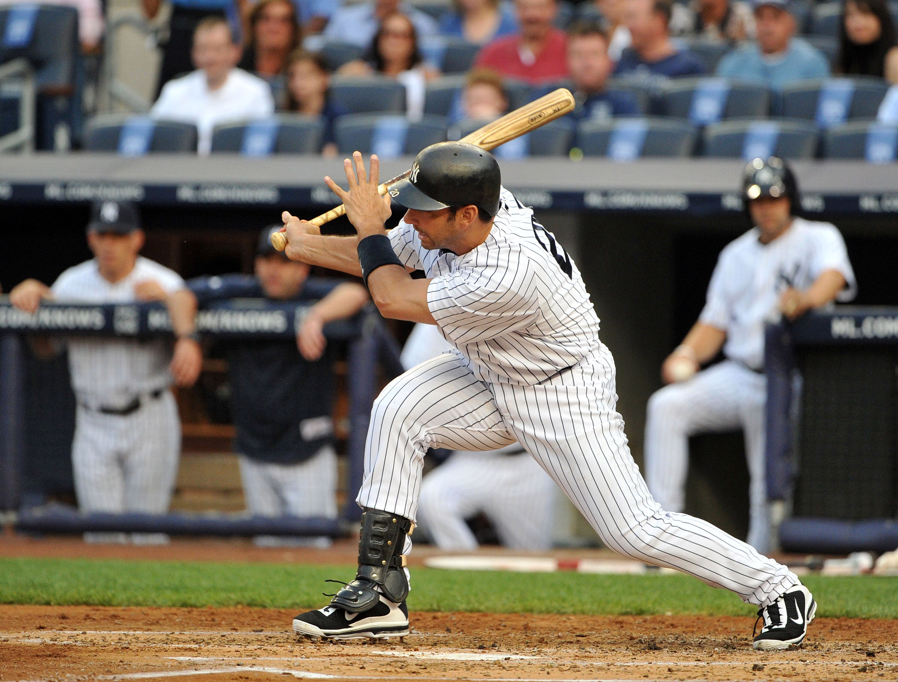 NEW YORK, NY - JUNE 10: Jorge Posada #20 of the New York Yankees connects for an RBI single in the bottom of the first inning against the Cleveland Indians on June 10, 2011 at Yankee Stadium in the Bronx borough of New York City. (Photo by Christopher Pas