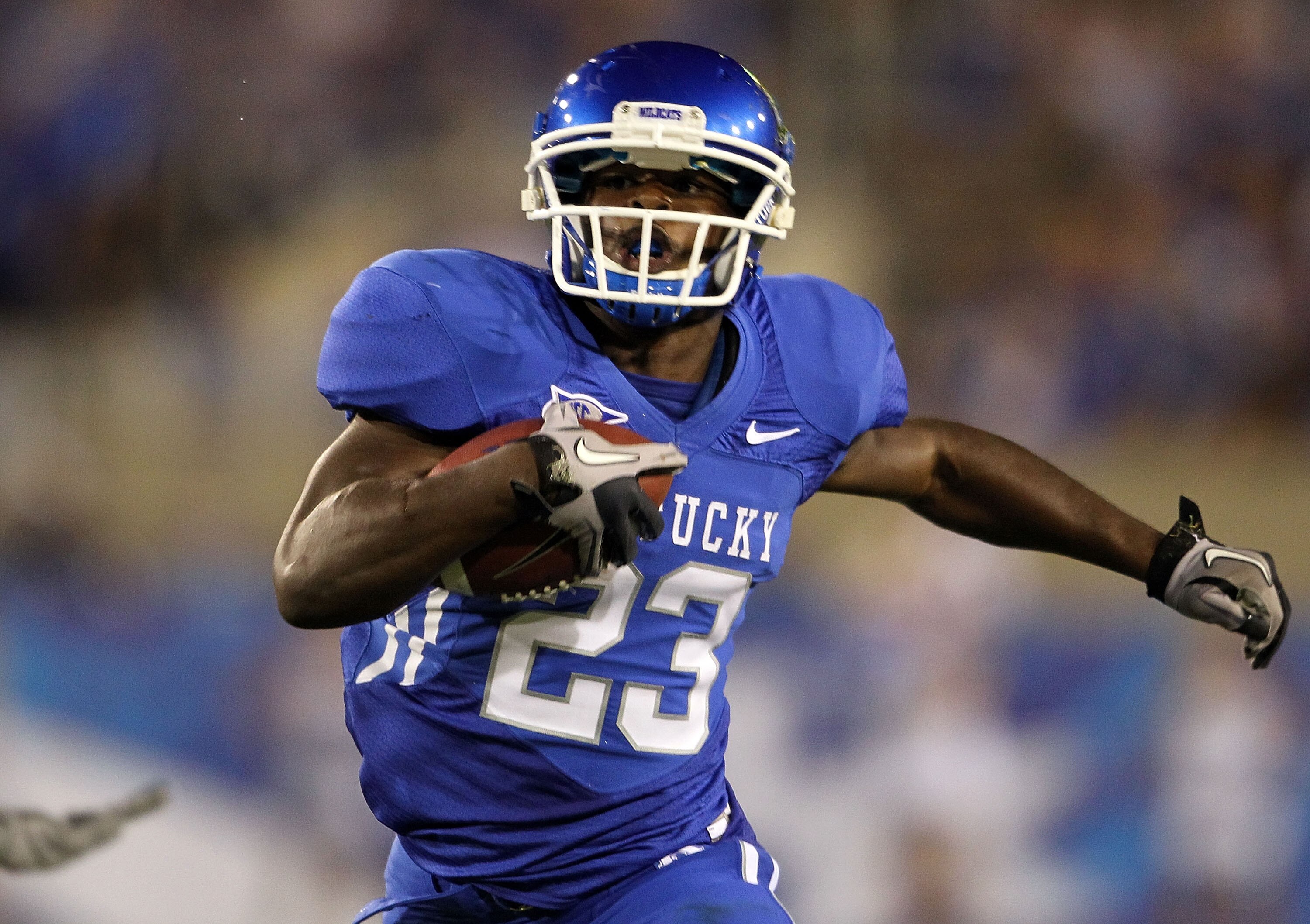LEXINGTON, KY - SEPTEMBER 18: Donald Russell #23 of the Kentucky Wildcats runs with the ball during the game against the Akron Zips at Commonwealth Stadium on September 18, 2010 in Lexington, Kentucky.  (Photo by Andy Lyons/Getty Images)