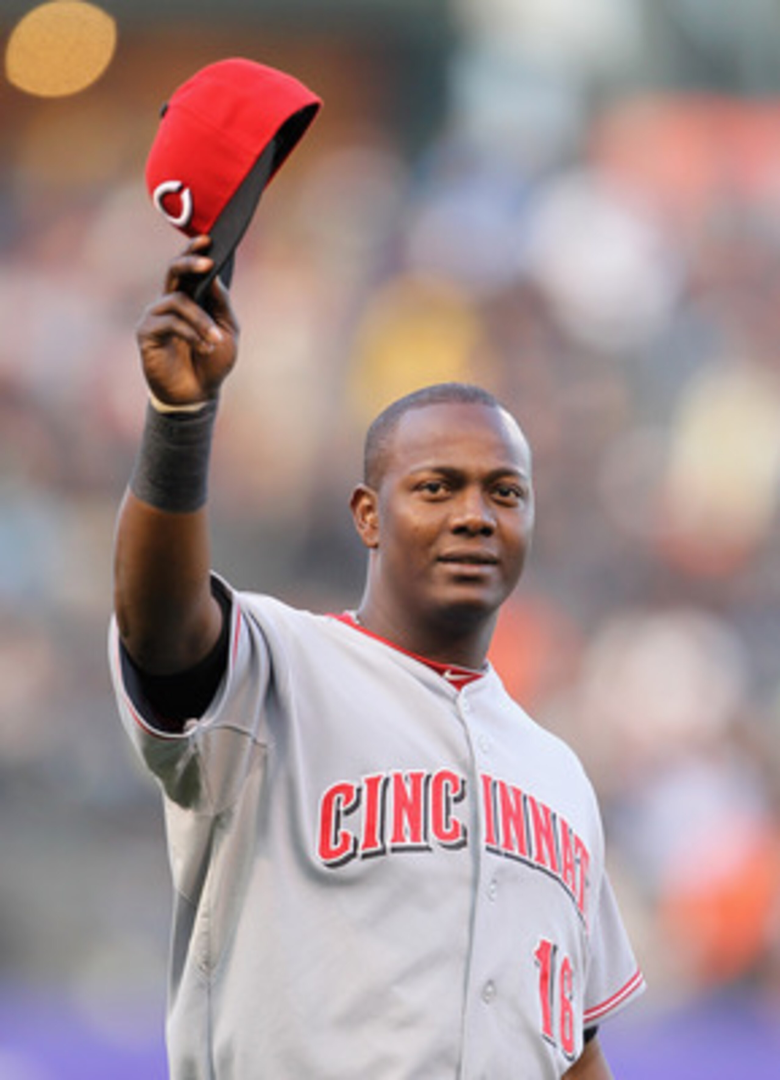 SAN FRANCISCO, CA - JUNE 09:  Edgar Renteria #16 of the Cincinnati Reds waves to the crowd after he received his World Series Championship ring that he won while playing for the San Francisco Giants last year before the Reds game against the Giants at AT&