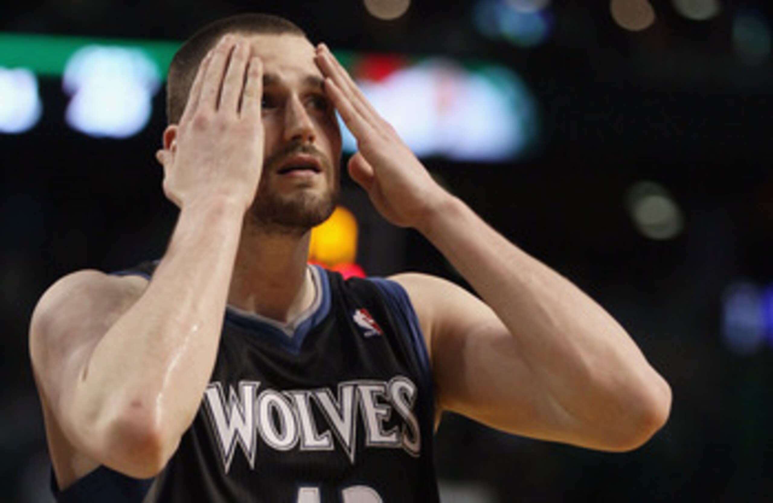 BOSTON, MA - JANUARY 03:  Kevin Love #42 of the Minnesota Timberwolves wipes his face in the fourth quarter against the Boston Celtics on January 3, 2011 at the TD Garden in Boston, Massachusetts. The Celtics defeated the Timberwolves 96-93. NOTE TO USER: