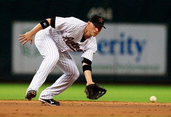 HOUSTON - MAY 24:  Shortstop Clint Barmes #12 of the Houston Astros fields a ground ball during a baseball game against the Los Angeles Dodgers at Minute Maid Park on May 24, 2011 in Houston, Texas.  (Photo by Bob Levey/Getty Images)
