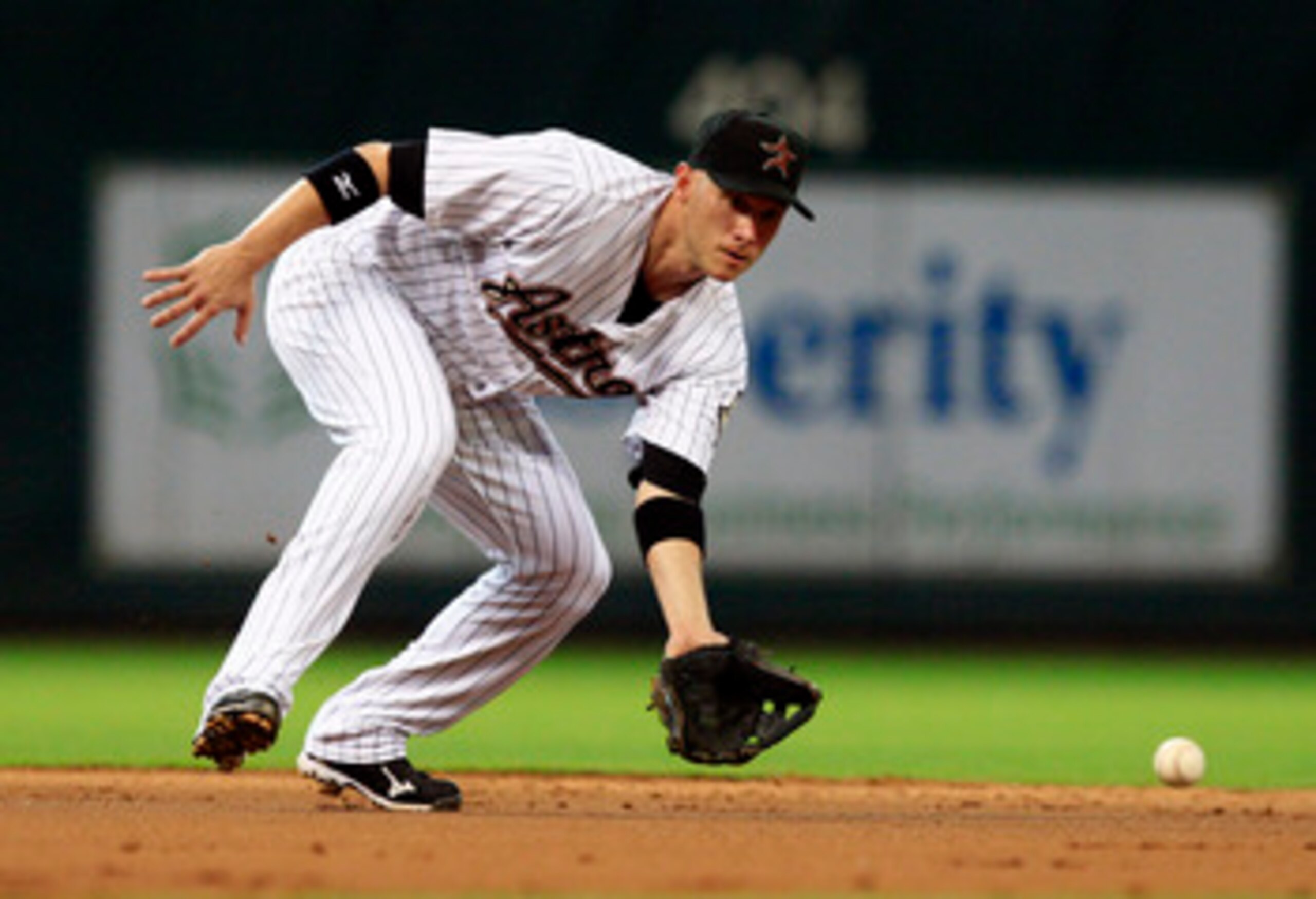 HOUSTON - MAY 24:  Shortstop Clint Barmes #12 of the Houston Astros fields a ground ball during a baseball game against the Los Angeles Dodgers at Minute Maid Park on May 24, 2011 in Houston, Texas.  (Photo by Bob Levey/Getty Images)