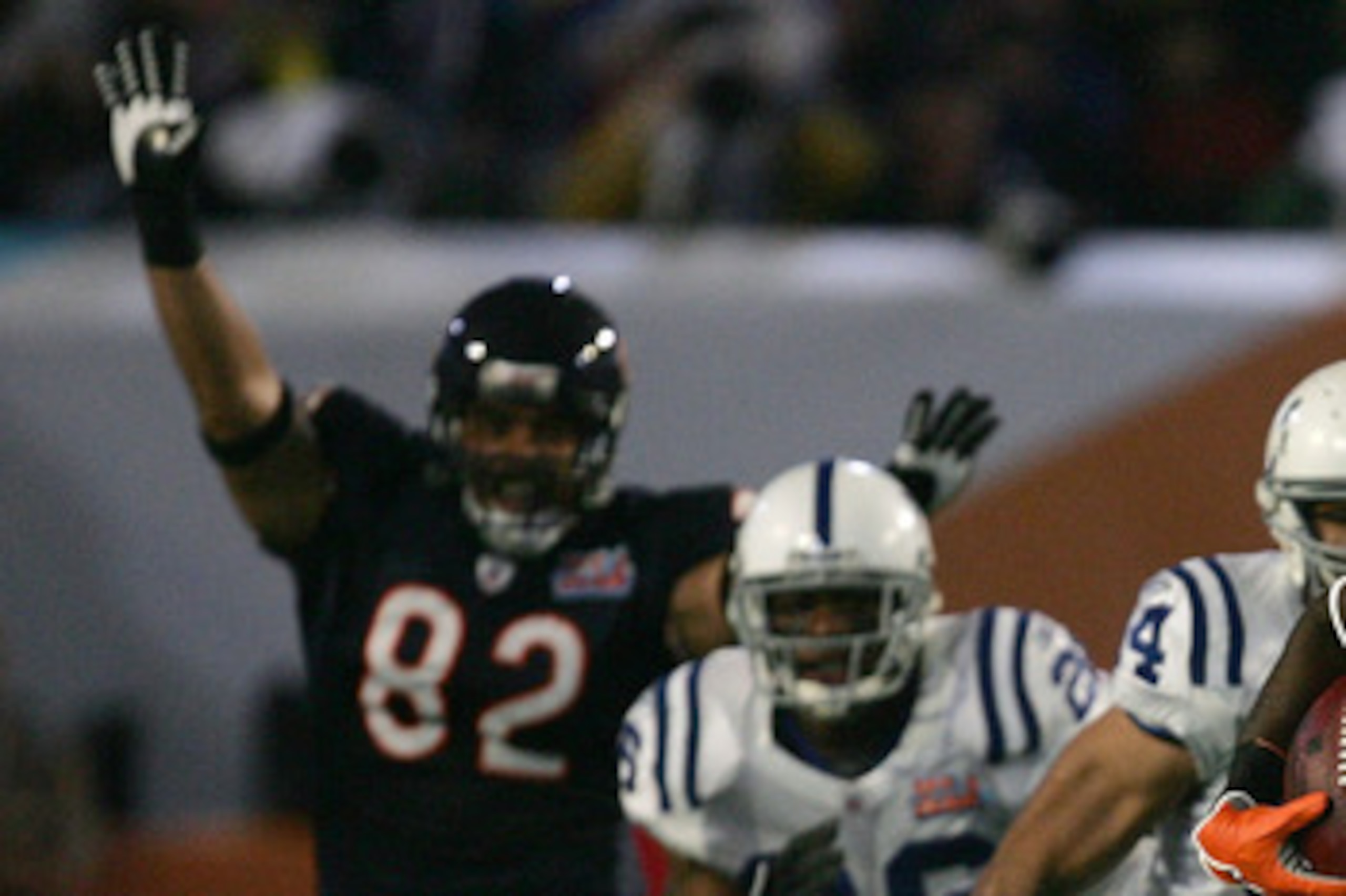 MIAMI GARDENS, FL - FEBRUARY 04:  Kick returner Devin Hester #23 of the Chicago Bears returns the opening kickoff 92-yards for a touchdown past a diving Adam Vinatieri #4 of the Indianapolis Colts in the first quarter of Super Bowl XLI on February 4, 2007