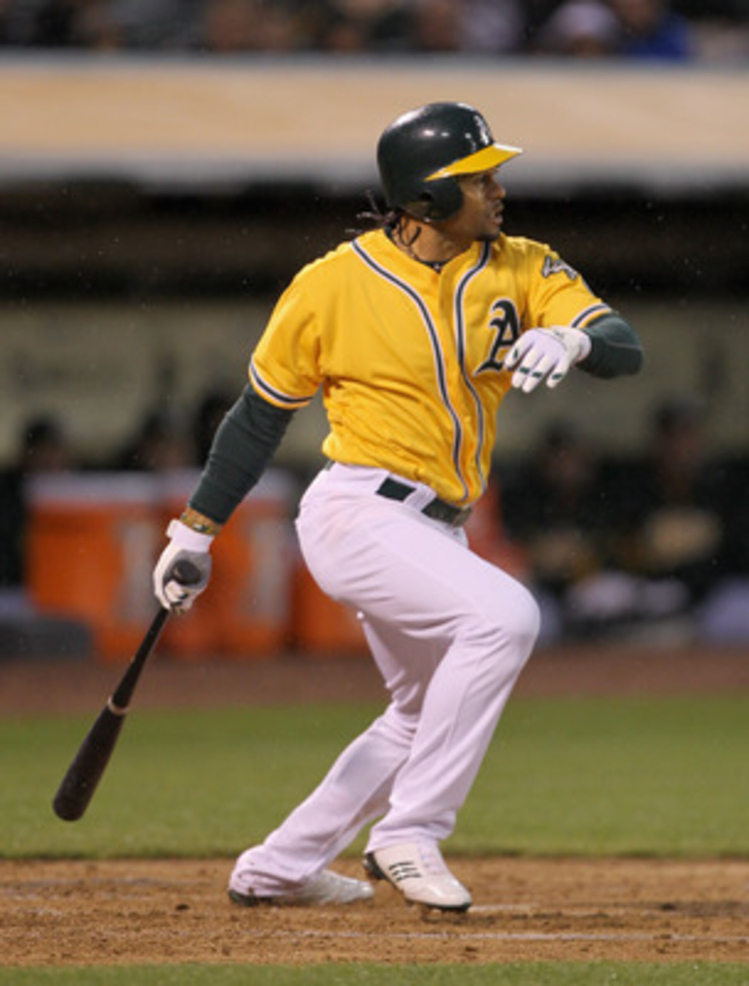 OAKLAND, CA - MAY 17:  Coco Crisp #4 of the Oakland Athletics hits a single to score Kevin Kouzmanoff #5 of the Oakland Athletics in the second inning of their game against the Los Angeles Angels of Anaheim at Oakland-Alameda County Coliseum on May 17, 20
