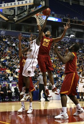 MINNEAPOLIS - MARCH 20:  Reggie Jackson #0 of the Boston College Eagles drives for a shot attempt against Taj Gibson #22 of the USC Trojans during the first round of the NCAA Division I Men's Basketball Tournament at the Hubert H. Humphrey Metrodome on Ma