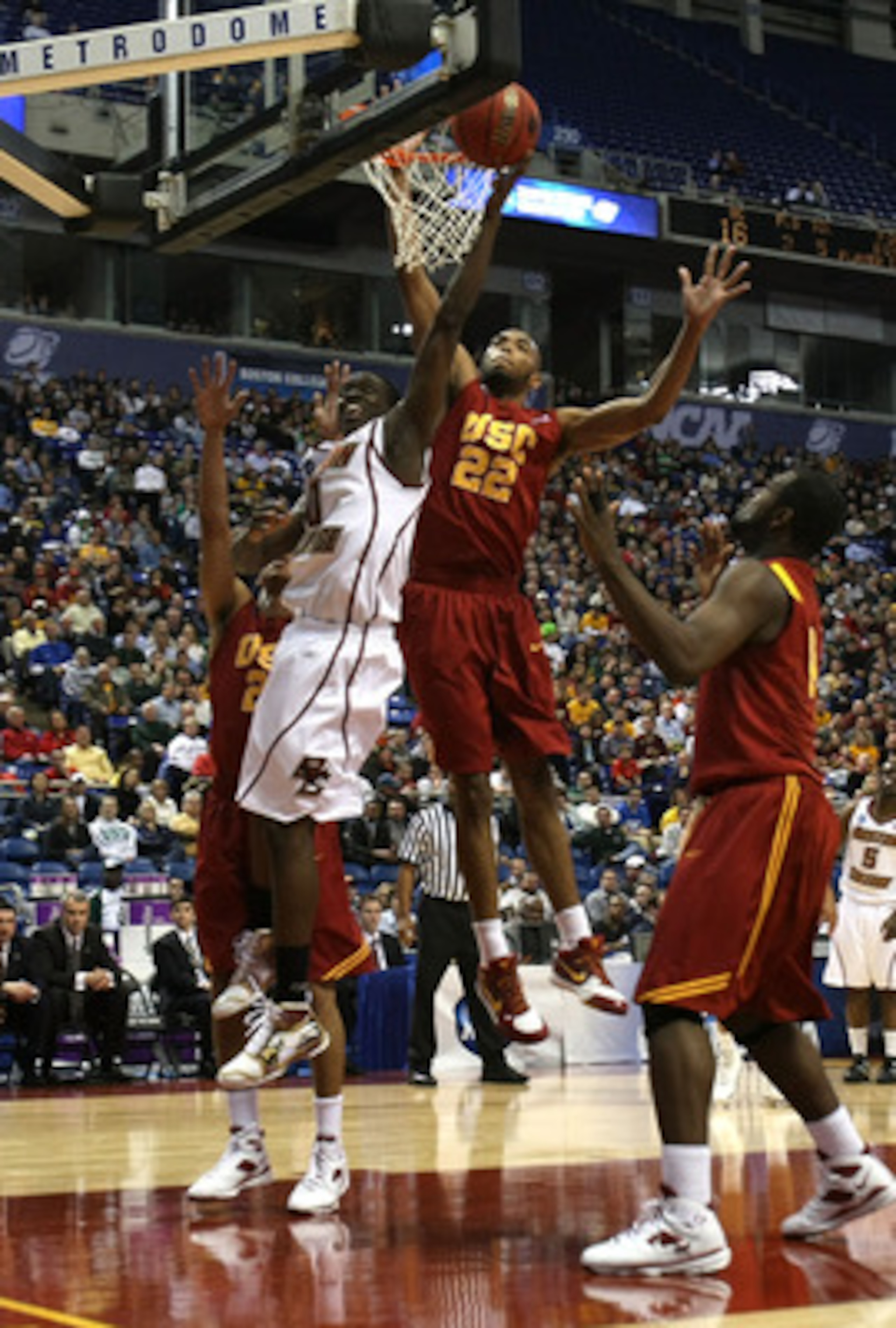 MINNEAPOLIS - MARCH 20:  Reggie Jackson #0 of the Boston College Eagles drives for a shot attempt against Taj Gibson #22 of the USC Trojans during the first round of the NCAA Division I Men's Basketball Tournament at the Hubert H. Humphrey Metrodome on Ma