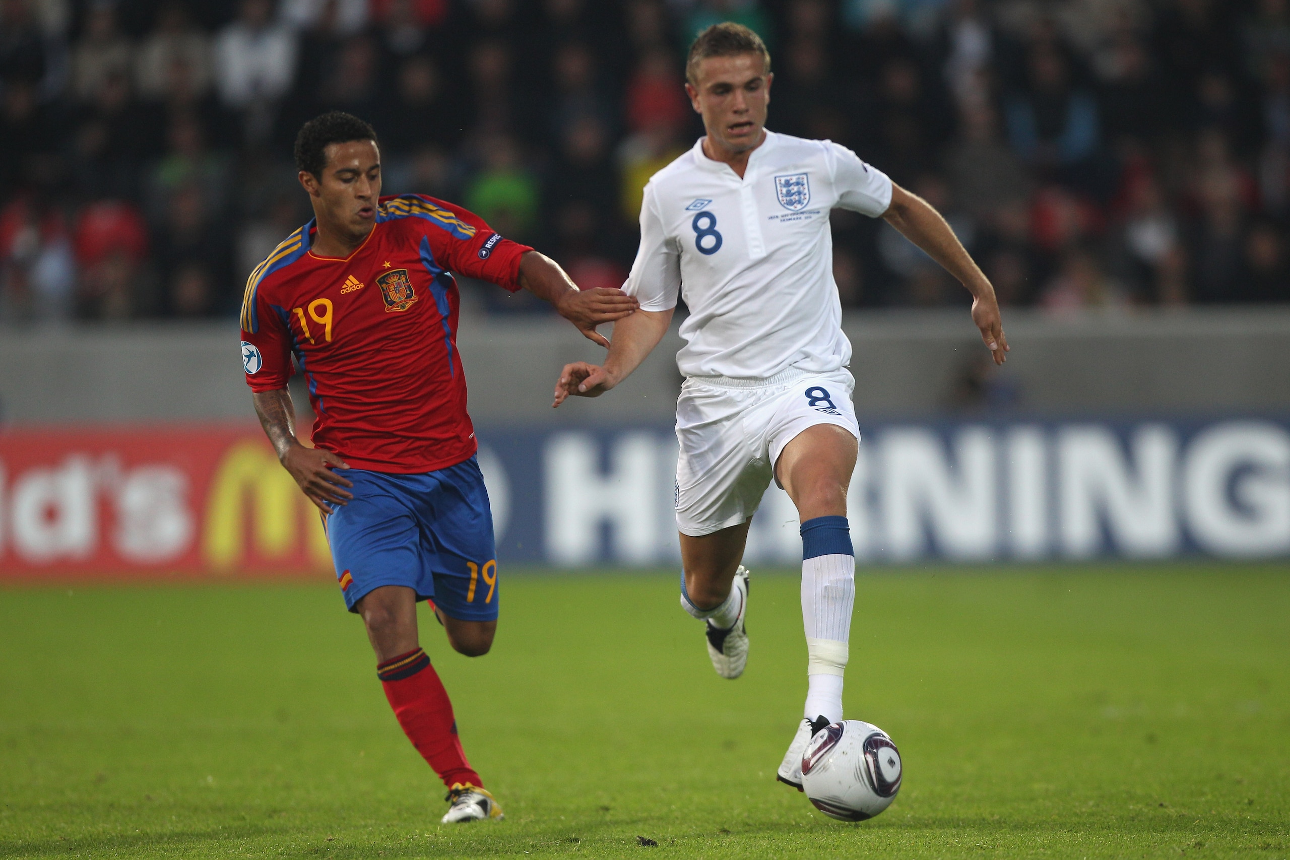HERNING, DENMARK - JUNE 12:  Jordan Henderson (R) of England is tracked by Thiago Alcantara (L) during the UEFA European Under-21 Championship Group B match between England and Spain at the Herning Stadium on June 12, 2011 in Herning, Denmark.  (Photo by