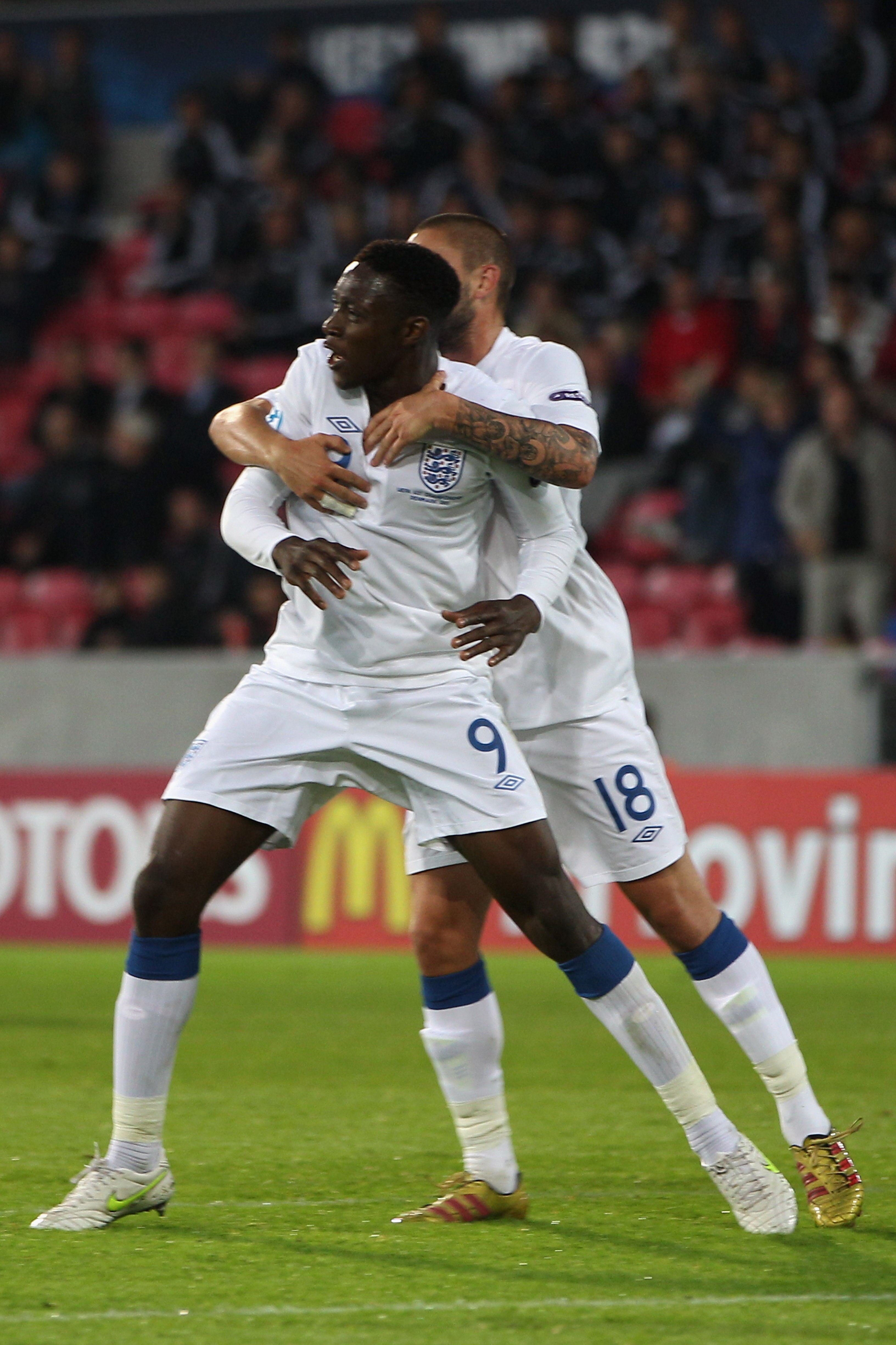 HERNING, DENMARK - JUNE 12:  Daniel Welbeck (L) of England celebrates scoring the equalising goal with Henri Lansbury (R) during the UEFA European Under-21 Championship Group B match between England and Spain at the Herning Stadium on June 12, 2011 in Her