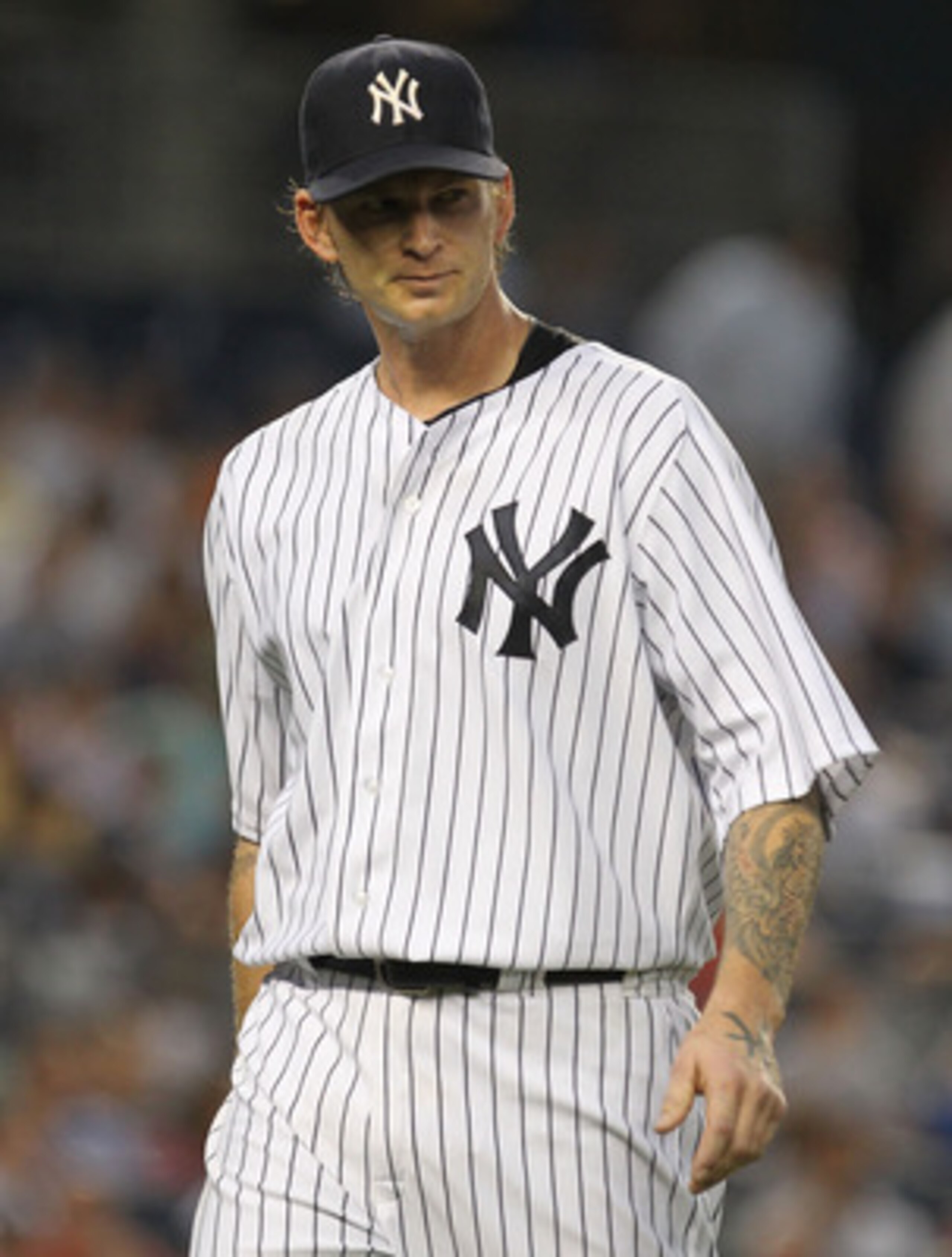 NEW YORK, NY - JUNE 08: A.J. Burnett #34 of the New York Yankees heads back to the dugout after the fourth inning against the Boston Red Sox during their game on June 8, 2011 at Yankee Stadium in the Bronx borough of New York City. (Photo by Al Bello/Ge NEW YORK, NY - JUNE 08: A.J. Burnett #34 of the New York Yankees heads back to the dugout after the fourth inning against the Boston Red Sox during their game on June 8, 2011 at Yankee Stadium in the Bronx borough of New York City. (Photo by Al Bello/Ge