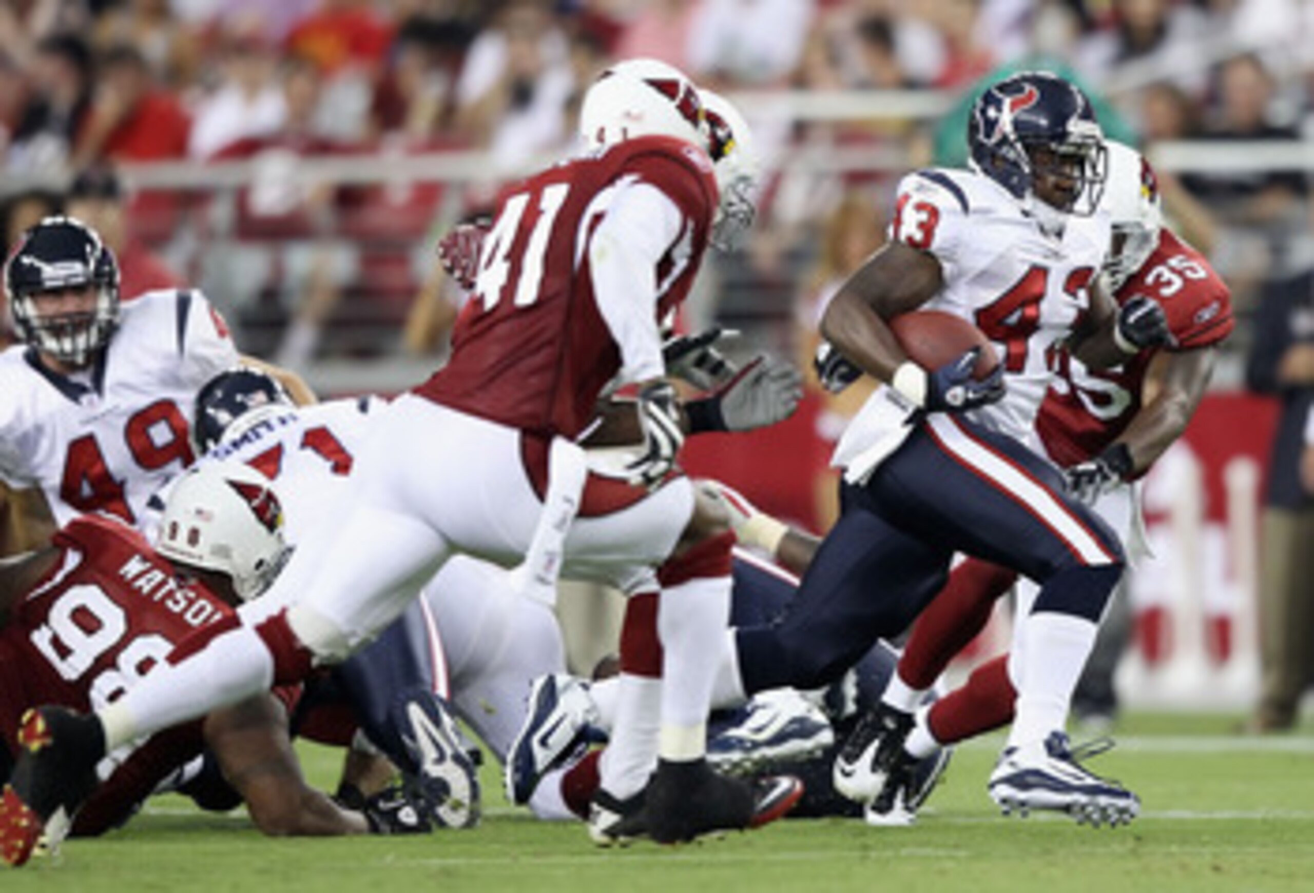 GLENDALE, AZ - AUGUST 14: Runningback Ben Tate #43 of the Houston Texans rushes the ball against the Arizona Cardinals during preseason NFL game at the University of Phoenix Stadium on August 14, 2010 in Glendale, Arizona. The Cardinals defeated the Texa GLENDALE, AZ - AUGUST 14: Runningback Ben Tate #43 of the Houston Texans rushes the ball against the Arizona Cardinals during preseason NFL game at the University of Phoenix Stadium on August 14, 2010 in Glendale, Arizona. The Cardinals defeated the Texa