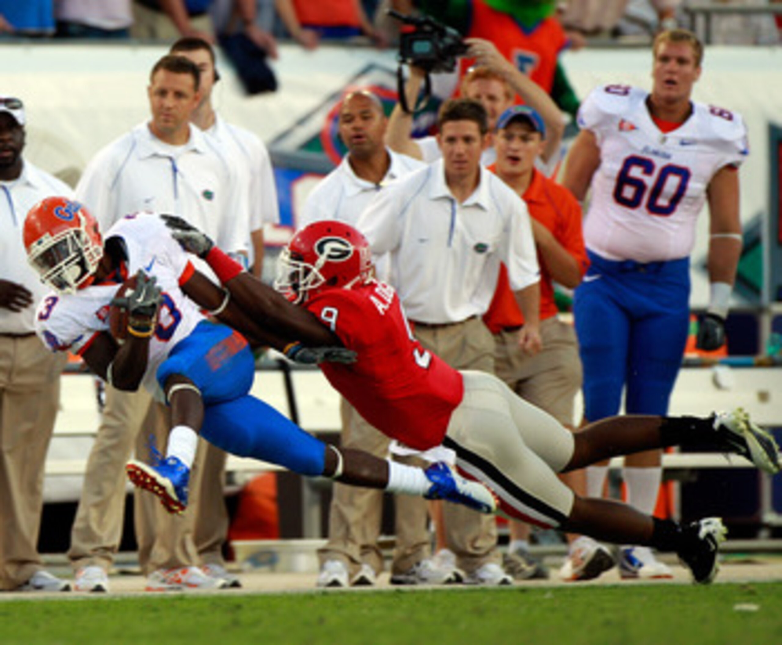 JACKSONVILLE, FL - OCTOBER 30:  Chris Rainey #3 of the Florida Gators is sent out of bounds by Alec Ogletree #9 of the Georgia Bulldogs during the game at EverBank Field on October 30, 2010 in Jacksonville, Florida.  (Photo by Sam Greenwood/Getty Images)
