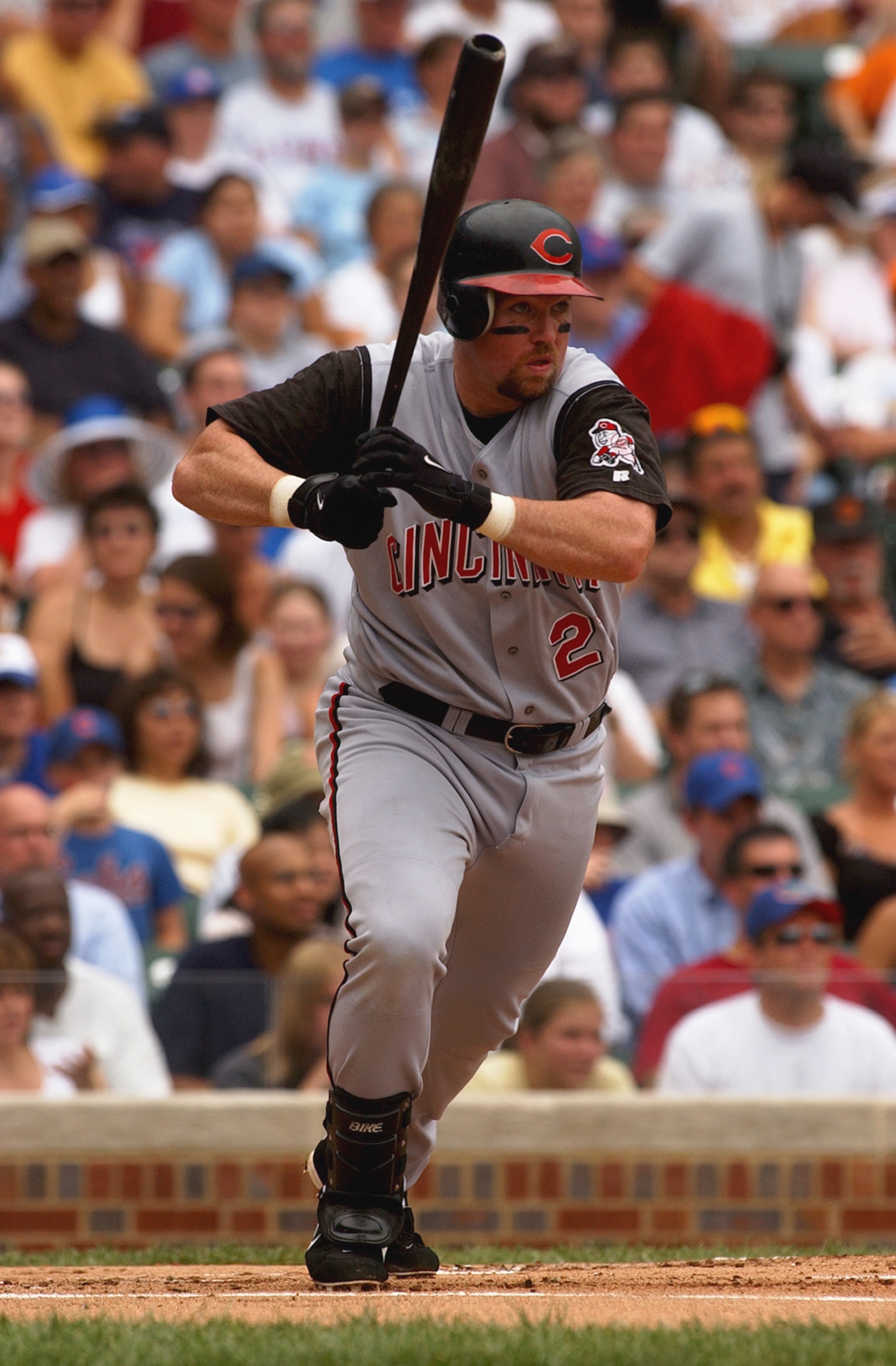 CHICAGO - JULY 21:  Sean Casey #21 of the Cincinnati Reds swings at a Chicago Cubs pitch during a game at Wrigley Field on July 21, 2004 in Chicago, Illinois. The Cubs defeated the Reds 5-4. (Photo by Jonathan Daniel/Getty Images)