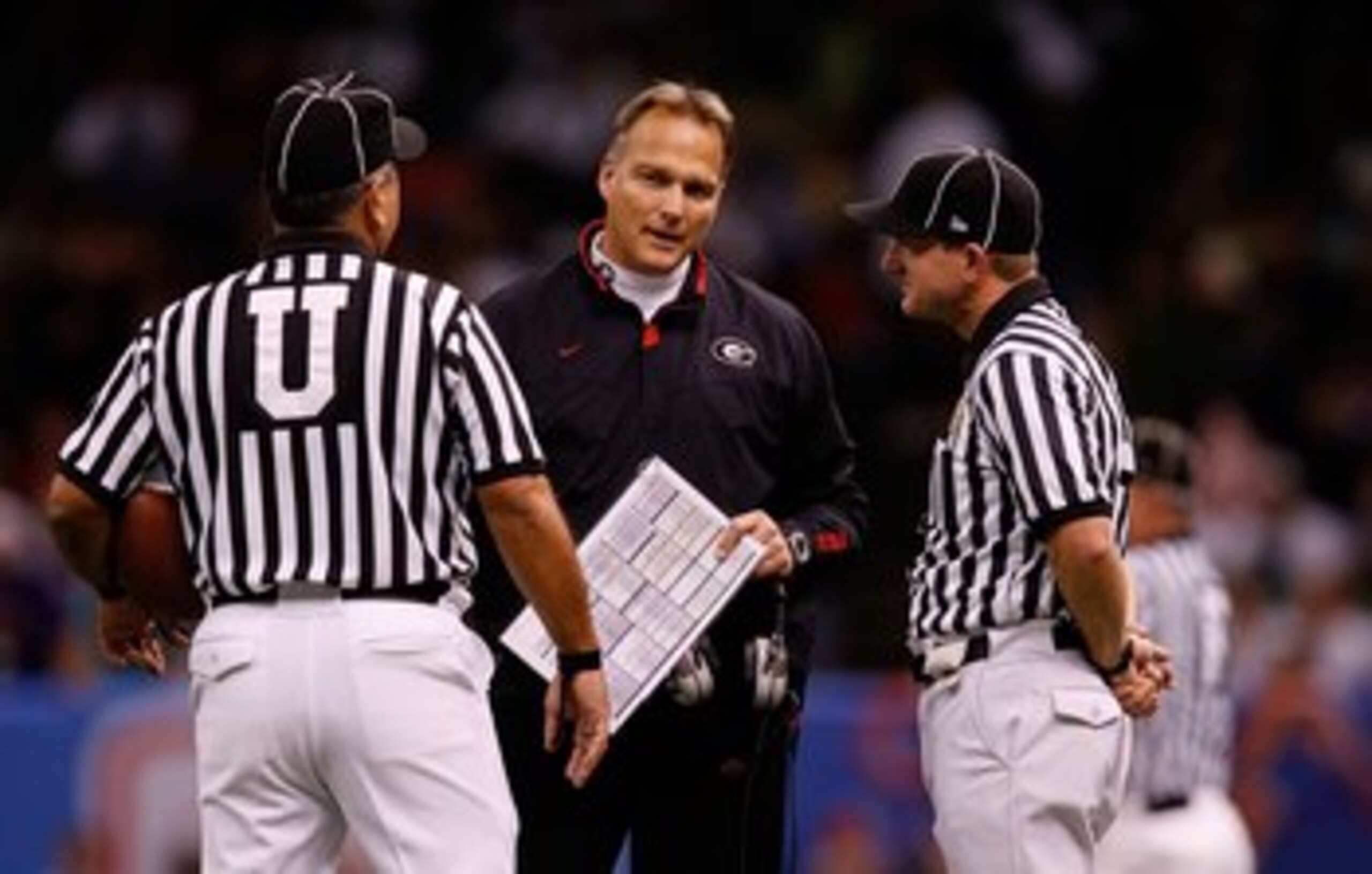 NEW ORLEANS - JANUARY 01:  Head coach Mark Richt of the Georgia Bulldogs talks with officials against the Hawai'i Warriors during the Allstate Sugar Bowl at the Louisiana Superdome on January 1, 2008 in New Orleans, Louisiana.  (Photo by Chris Graythen/Ge