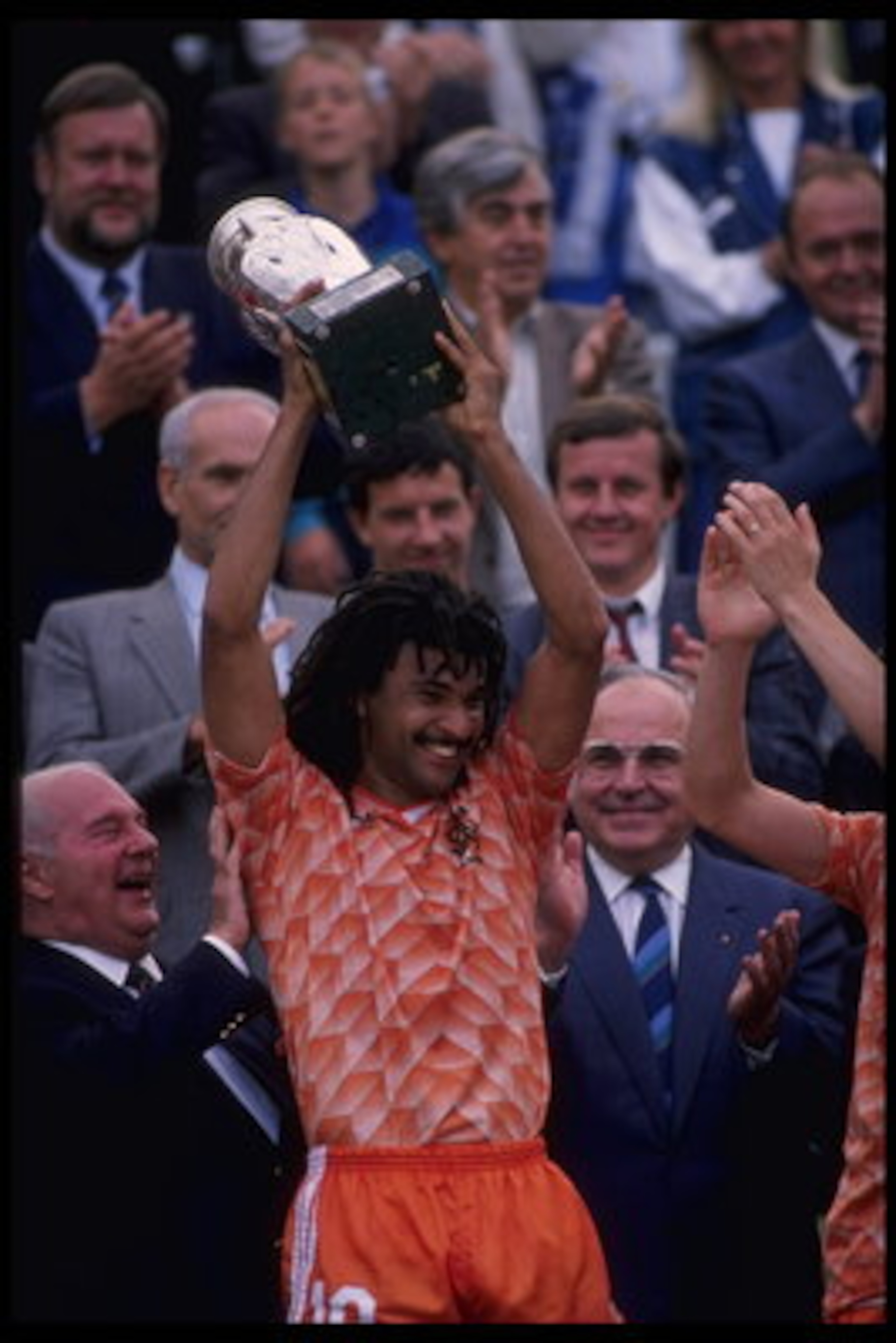 Jun 1988:  Ruud Gullit of Holland hold aloft the European nations trophy after Holland defeats Russia 2-0 in the Final of the European nations cup in Munich, Germany.                                     Mandatory Credit: Allsport UK